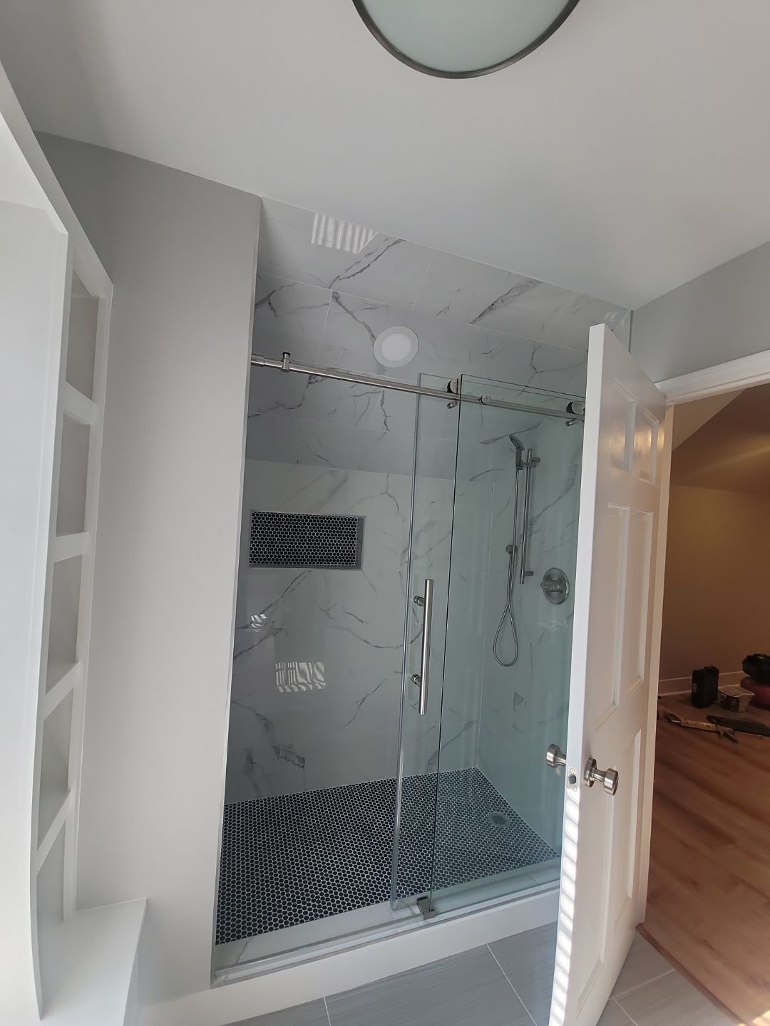 From Rafters to Retreat: An Attic Transformed with a Luxe Bath Escape by Elite Remodeling and Design LLC