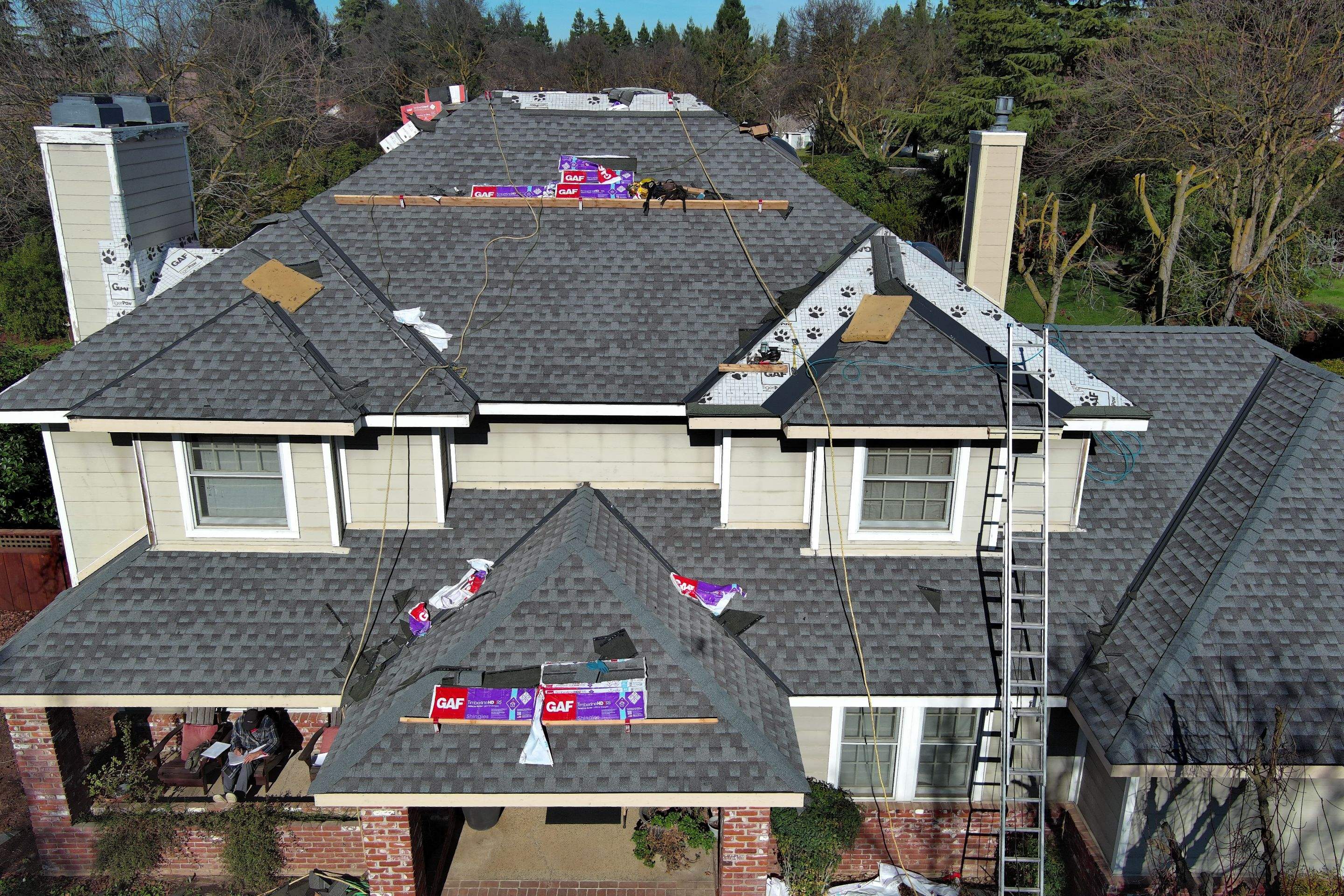 New shingles and gutters using GAF Timberline HDZ shingles and aluminum gutter by Straight Edge Roofing Inc