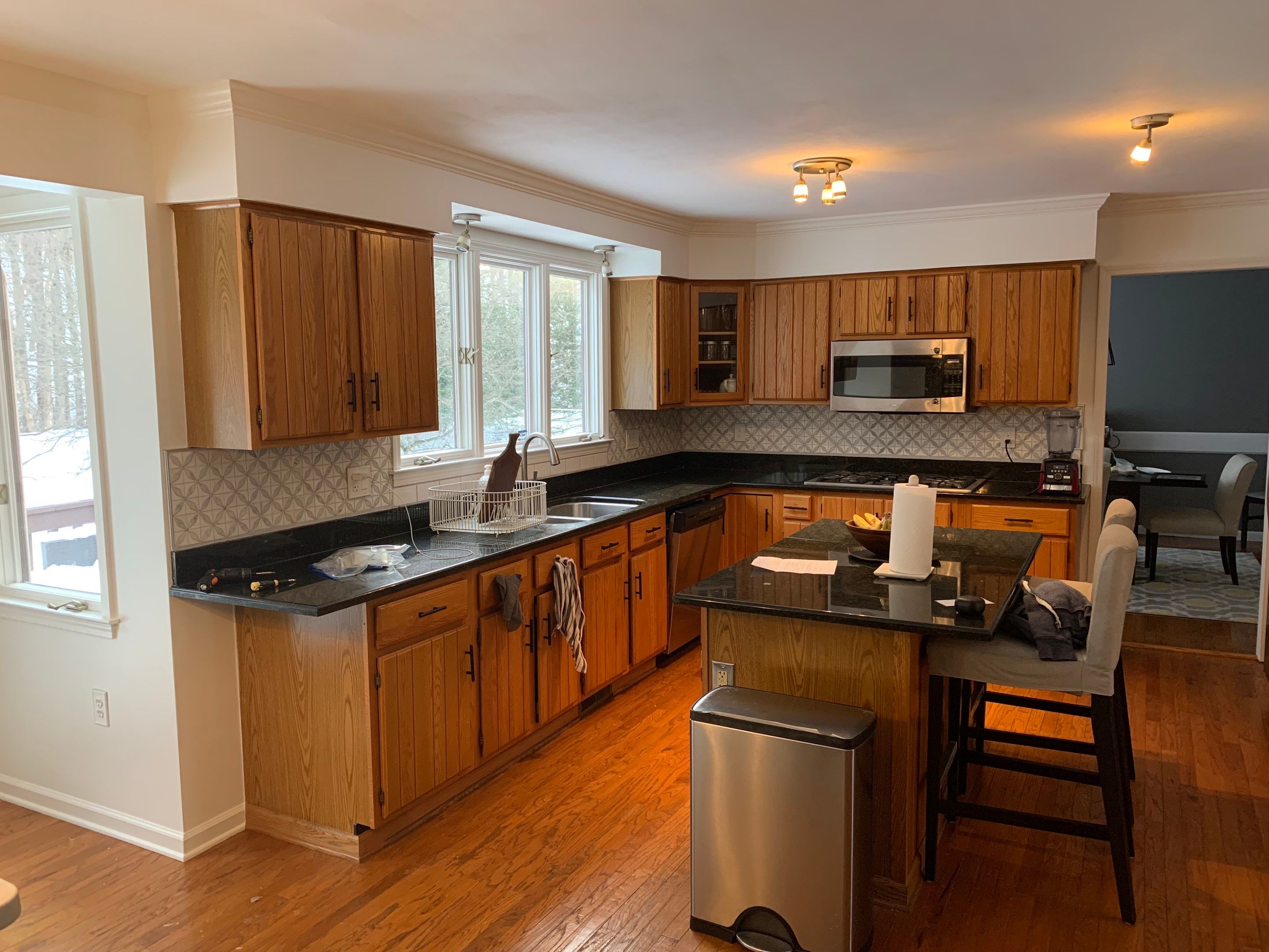 Painting Stained Wood Trim and Staircase. Walls too! by Empire Painting Services, LLC