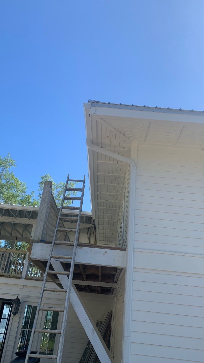 Seamless Gutter Installation Using White K-Style Aluminum Gutters by Gutter Professors