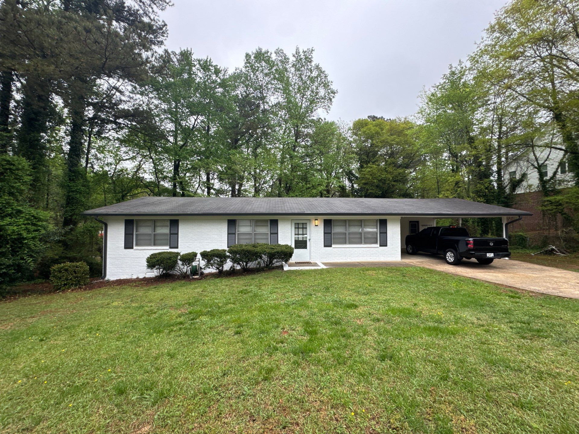 White Brick Exterior Painting and Shutter Refresh in Marietta by Swift Home Renovations