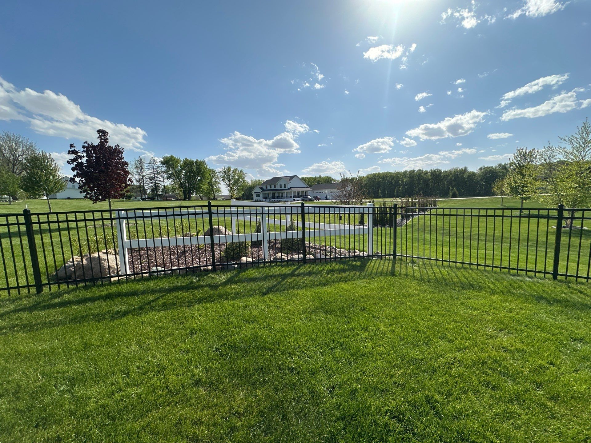 Black Ornamental Metal Picket Fence Installation in Waterloo by Perfect Picket Fence and Stain