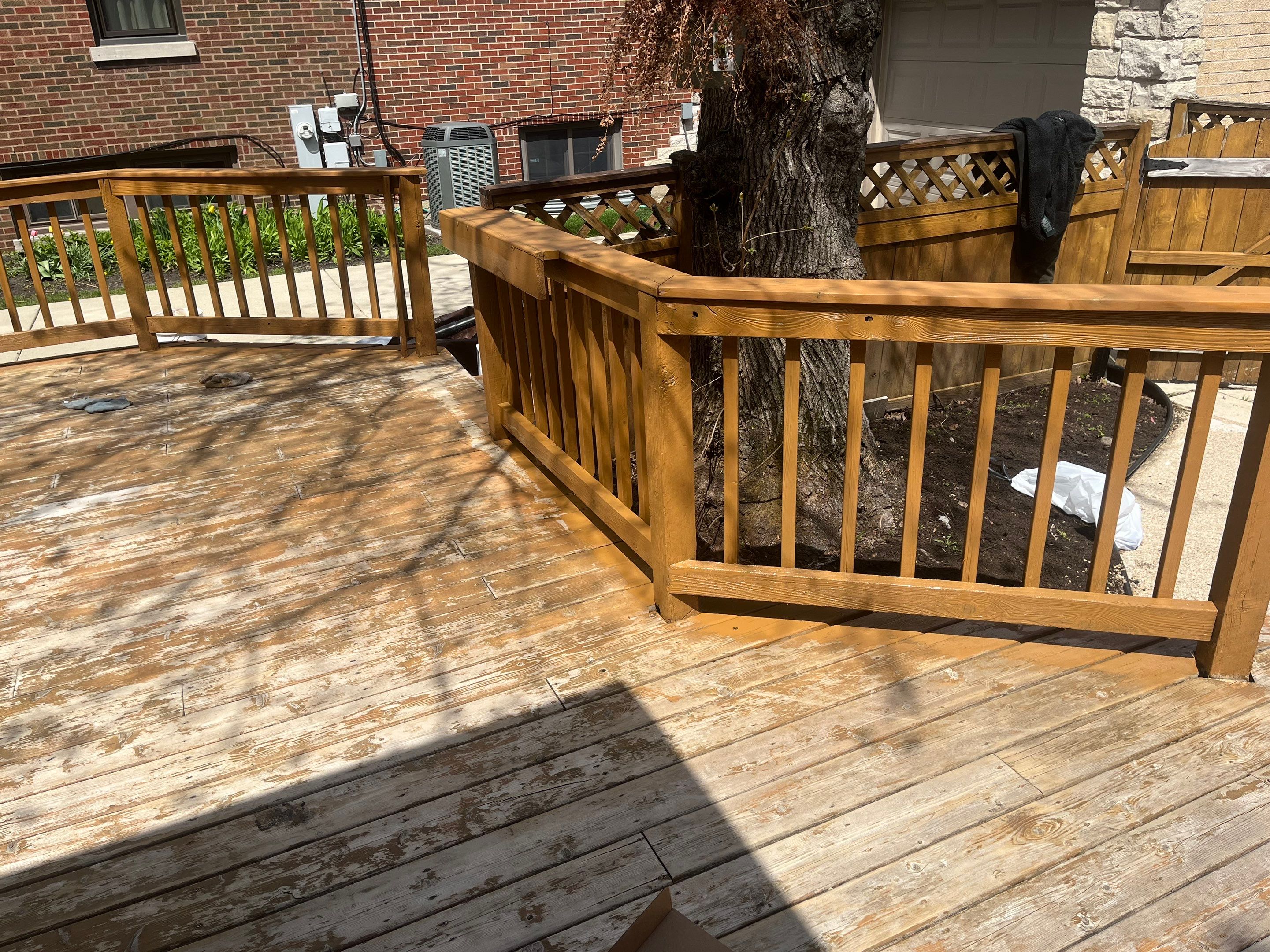 Wood cleaning and staining using Armstrong cloark oil stain by Northern Power Washing LLC.