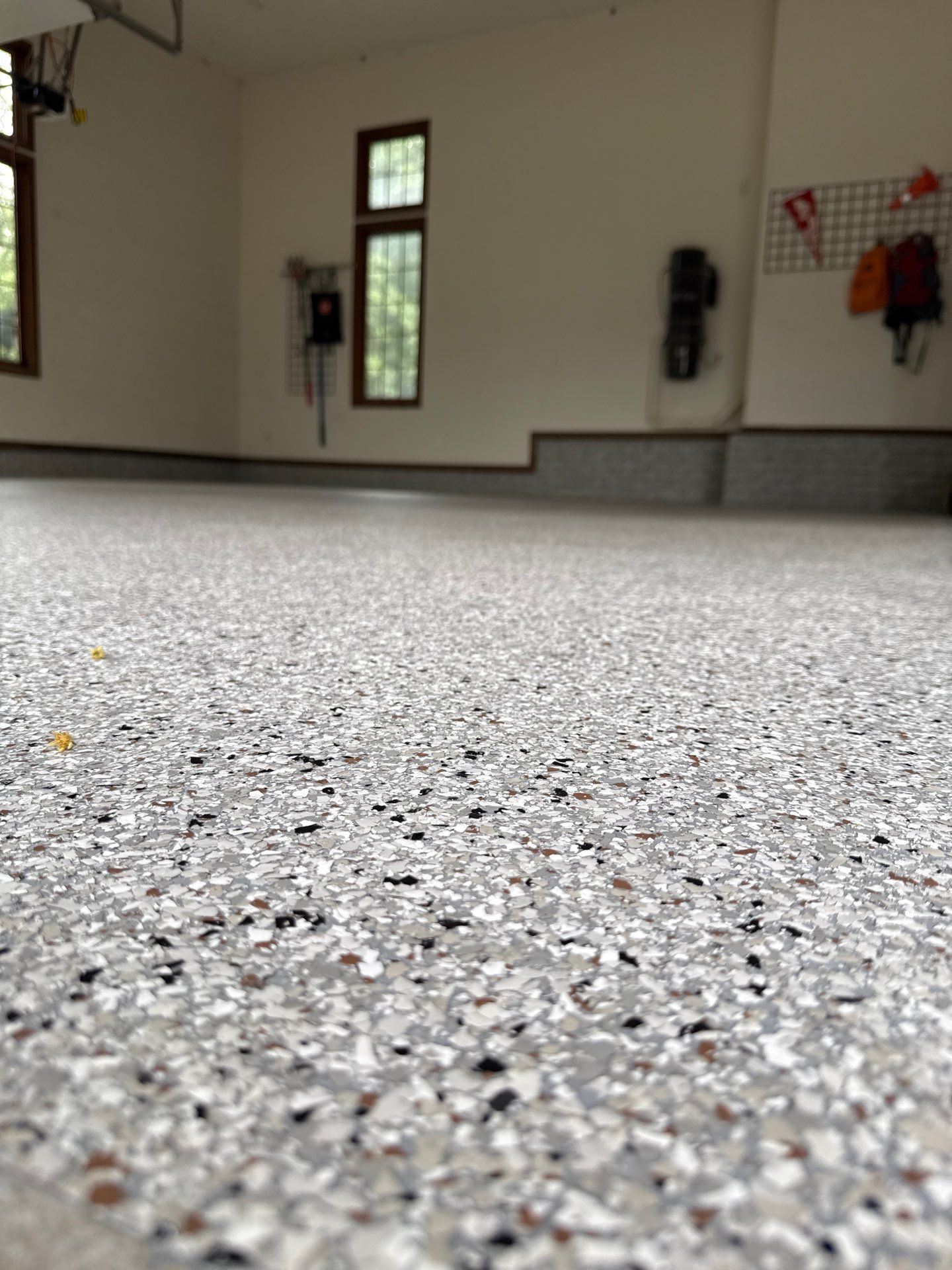 Coyote Flake Epoxy Garage Floor Coating in Earlham by Revival Concrete Coatings
