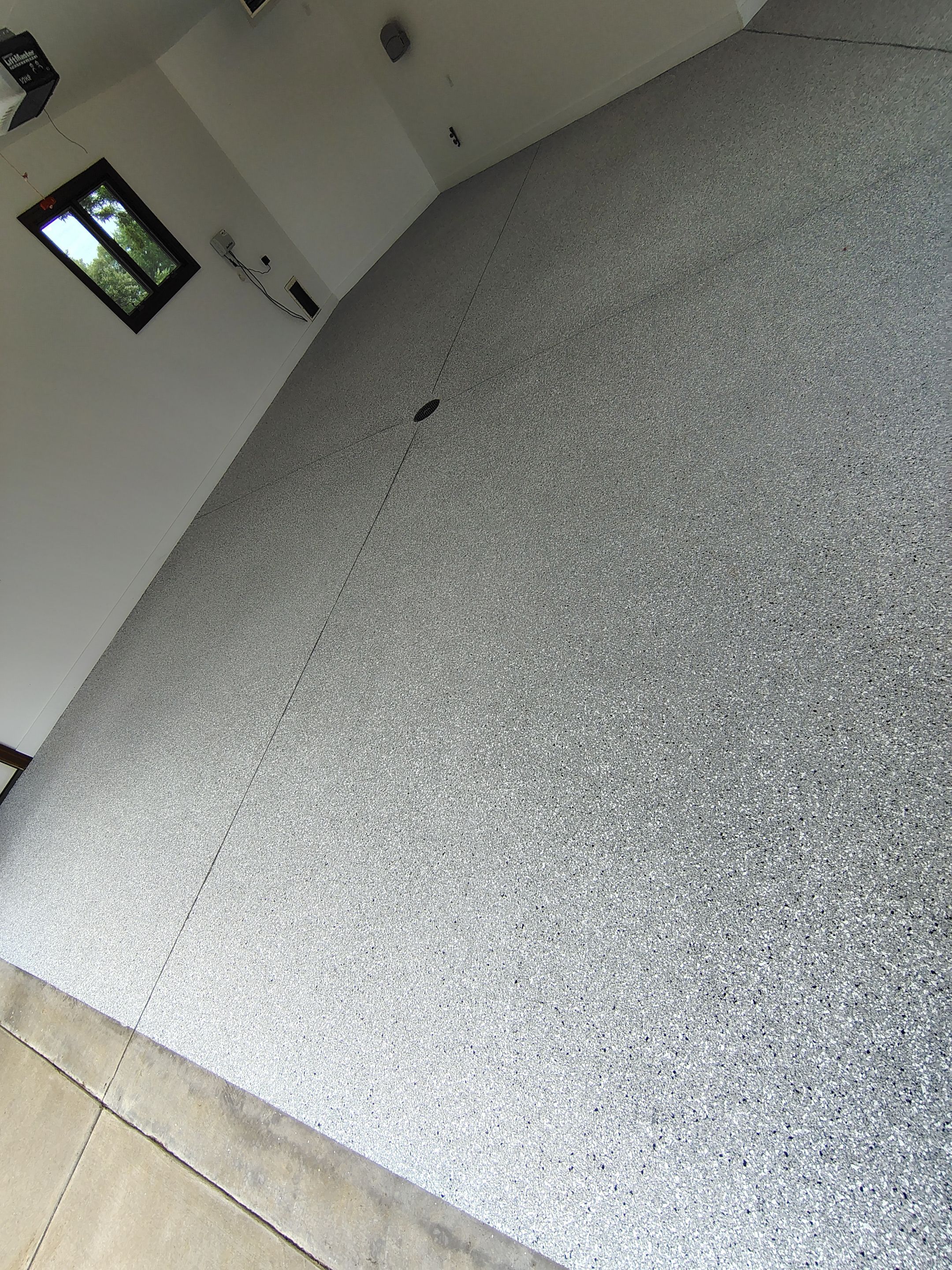 Feather Grey Floor Coating in Sioux Falls, SD by Select Painting, Coatings & Garage Cabinets