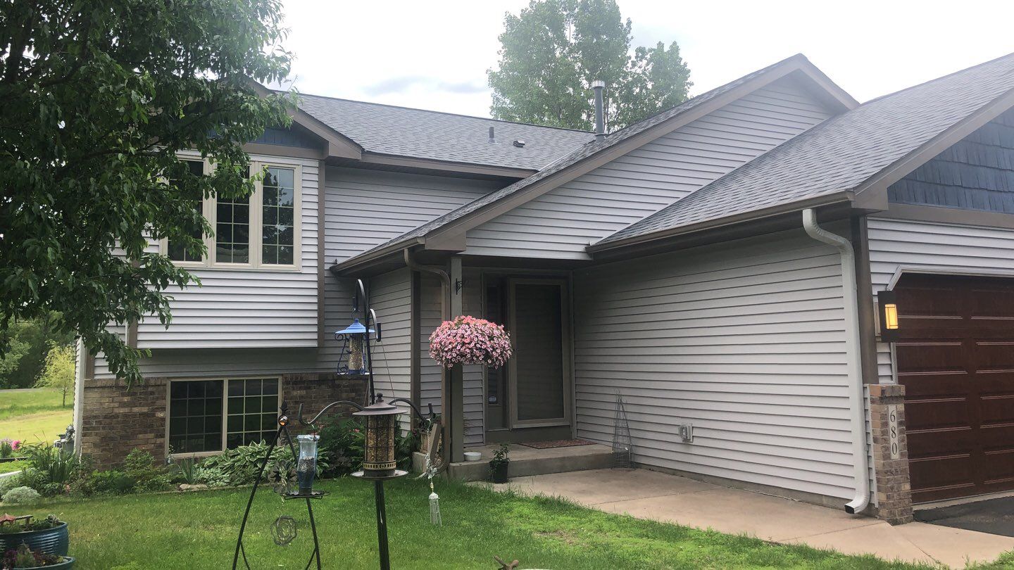 Storm Damage Restoration using Atlas Pinnacle Shingles and Mastic Vinyl Siding  by MODERN EXTERIOR SYSTEMS