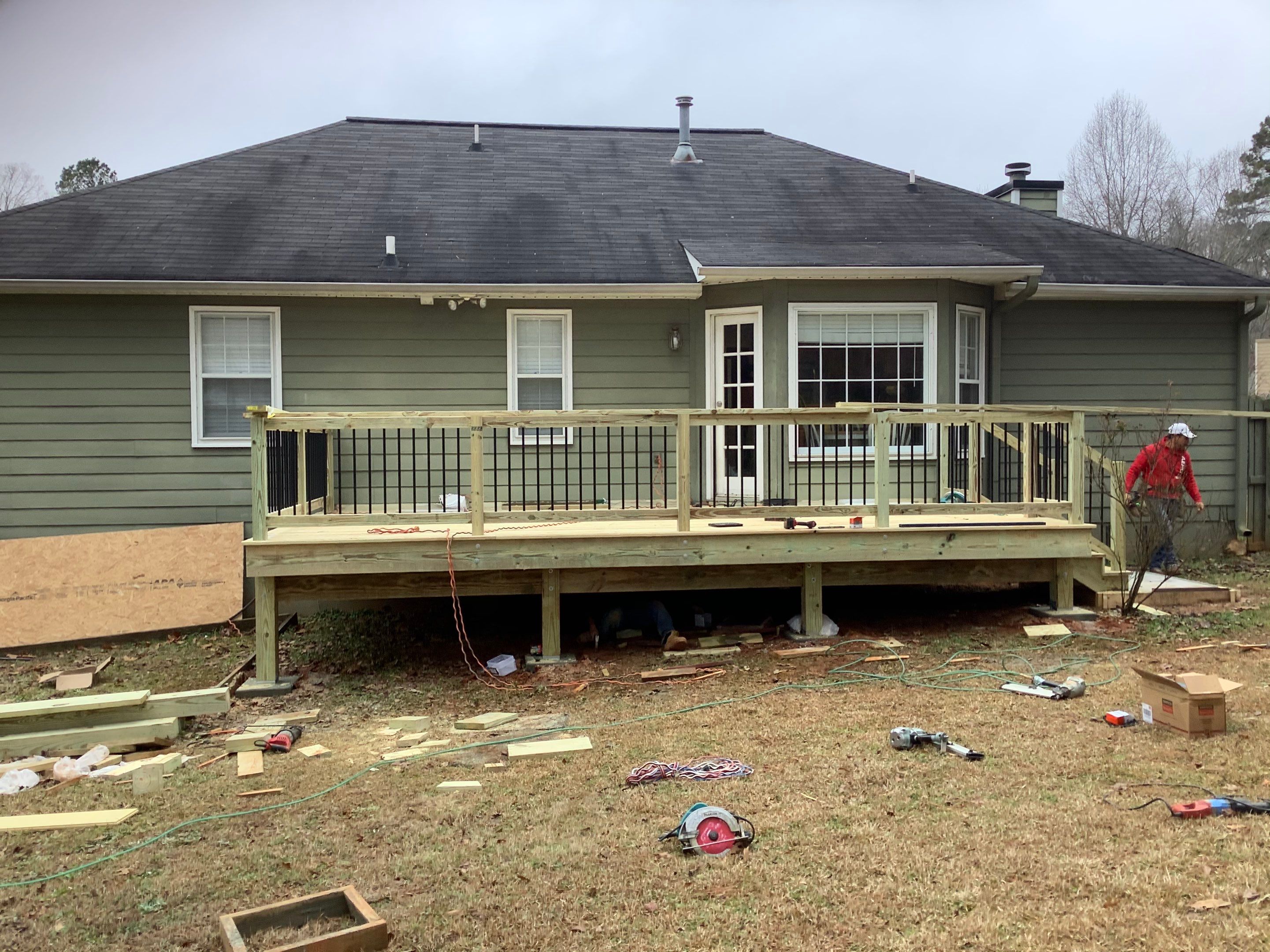 Raised Pressure-Treated Wood Deck Construction in Dallas, Georgia by Swift Home Renovations 