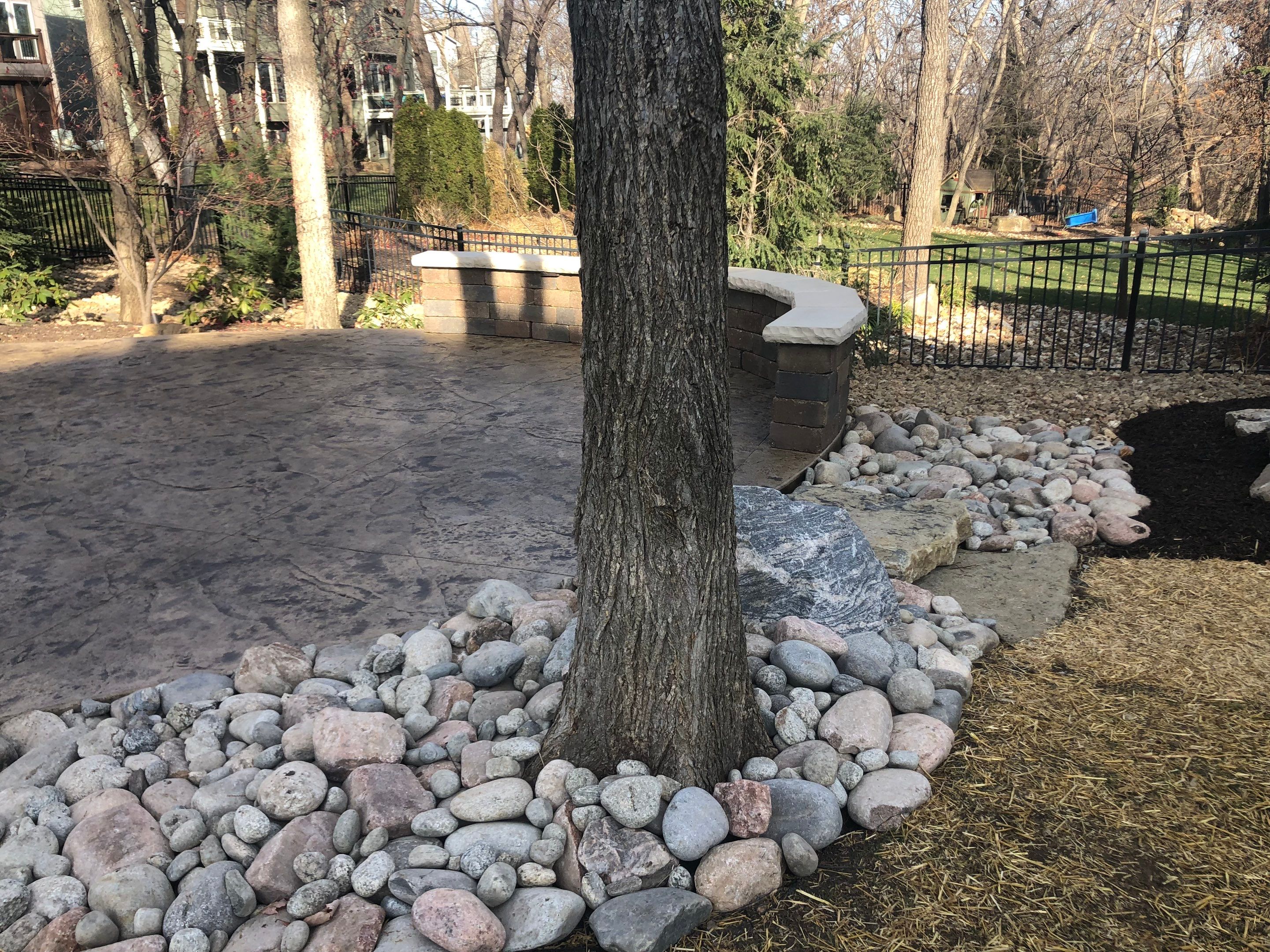 Back Yard Alpine Stamped Patio by LAND ESCAPES LLC