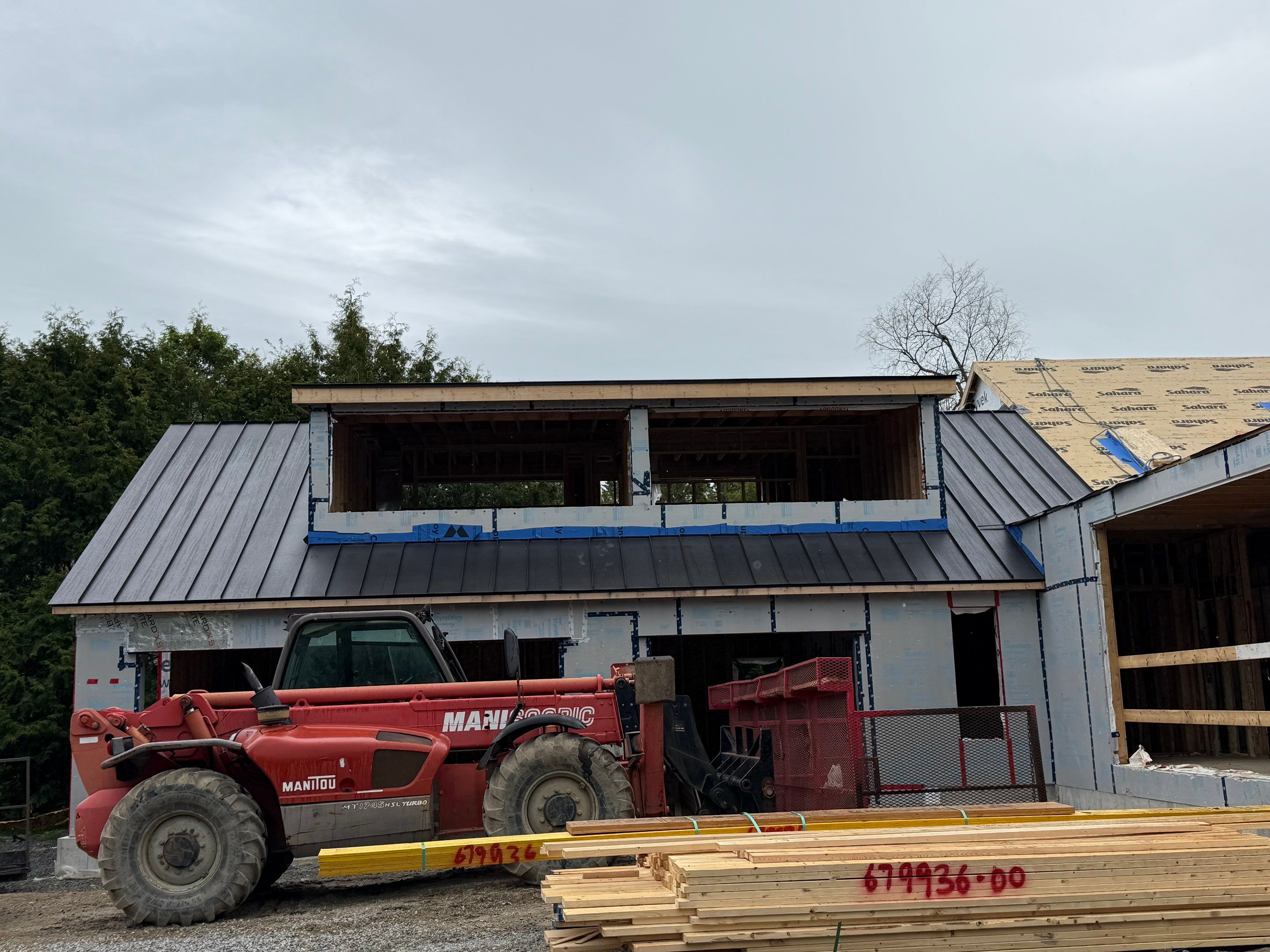 Custom Home Jet Black 24 GA Standing Seam Roof  by Jay Carter Roofing & Sheet Metal