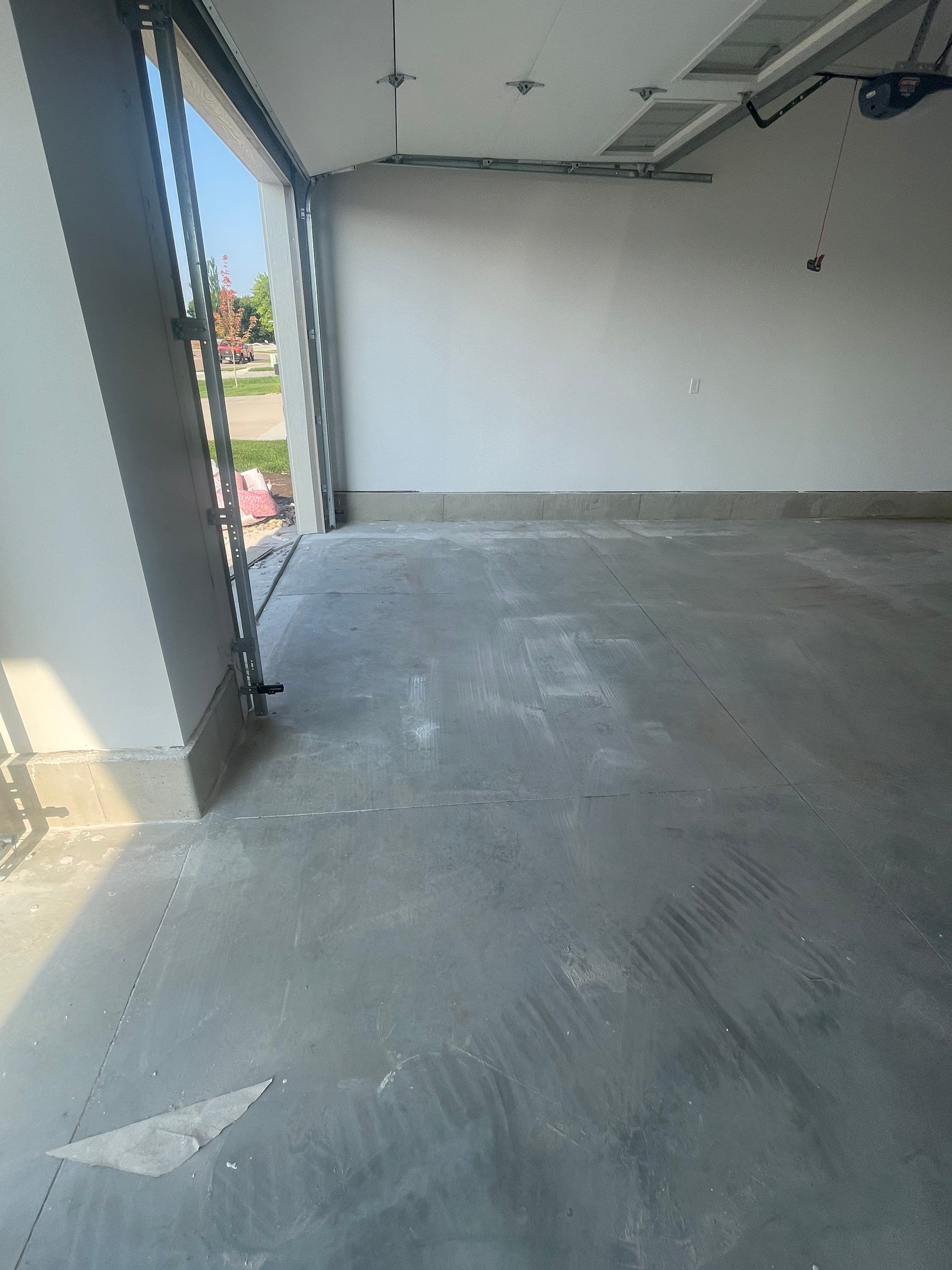 Grey Speckled Garage Floor Coating in Sioux Falls by Select Painting, Coatings & Garage Cabinets