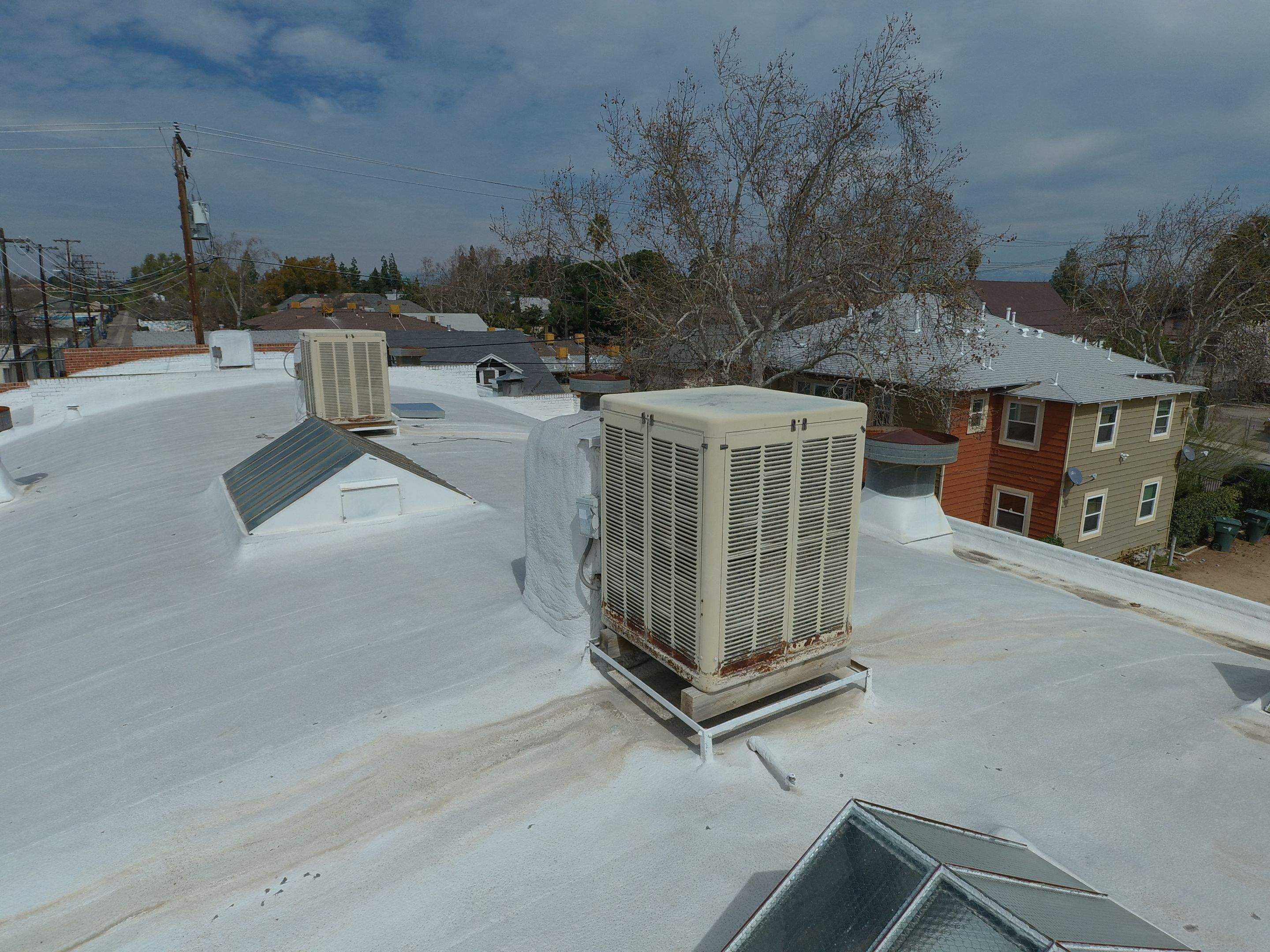 Polyurethane foam roof refurbish and recoating by Straight Edge Roofing Inc