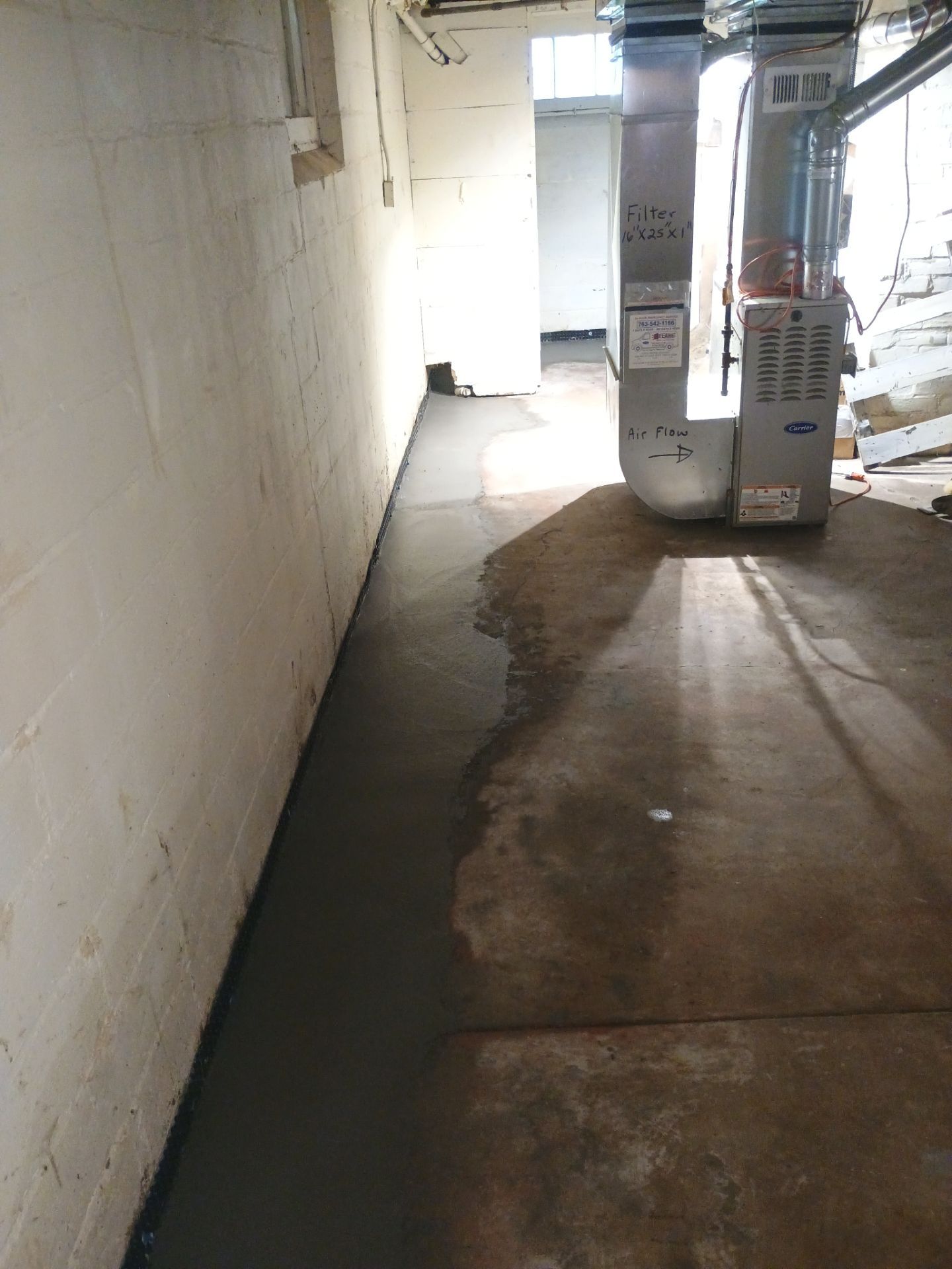 Interior Drain Tile & Sump Pump System in North Minneapolis by Waterproofing Northeast
