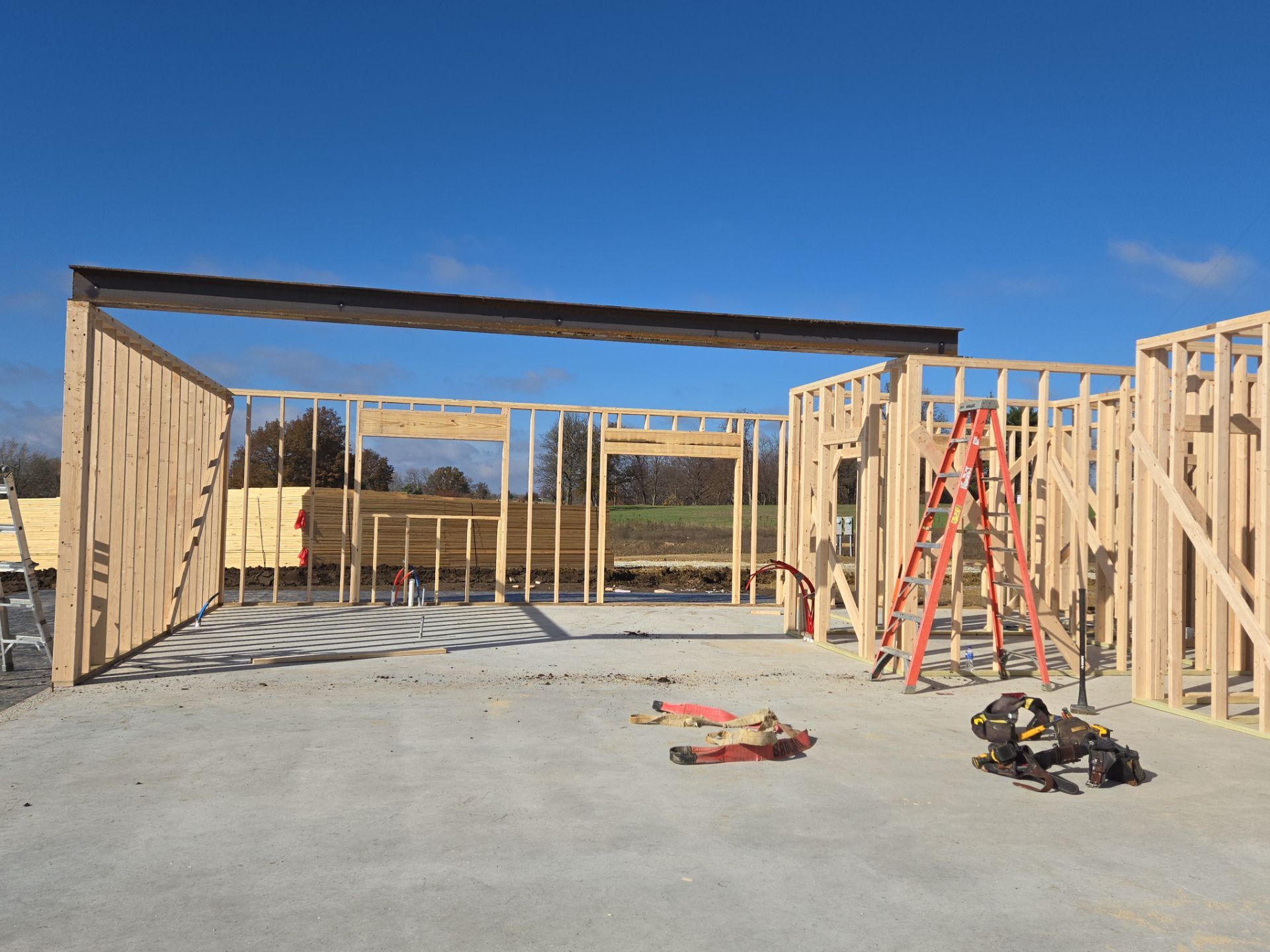 New Home construction w/ board and batten sides and metal roof  by Miles Construction 