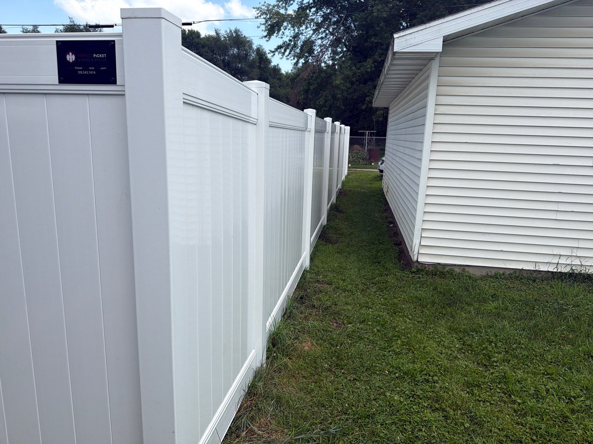 White Vinyl Privacy Fence Installation in Waterloo, Iowa by Perfect Picket Fence and Stain