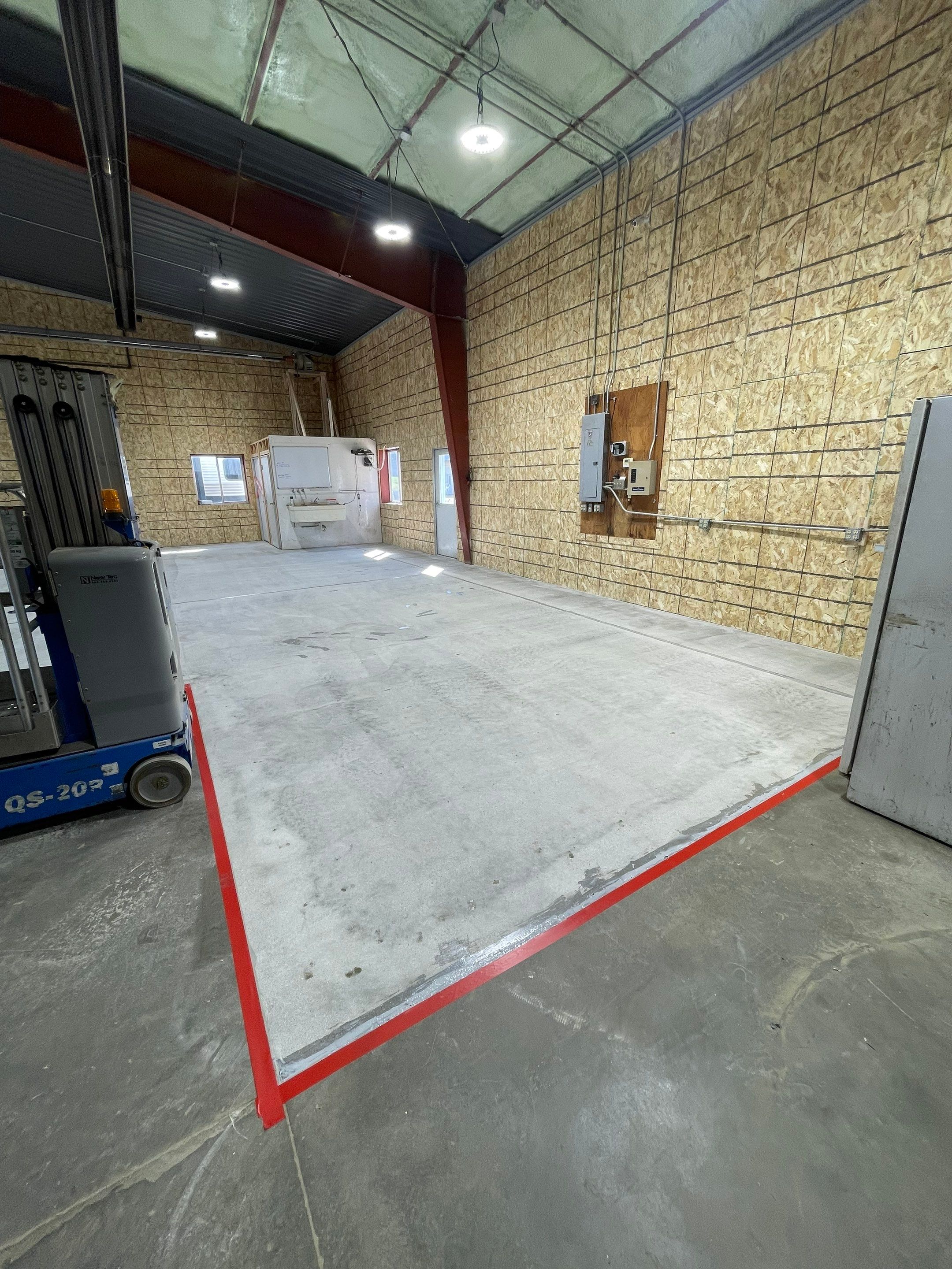Custom Polyurea Shop Floor with Basketball Court Lines in Rock Valley by Select Painting, Coatings & Garage Cabinets
