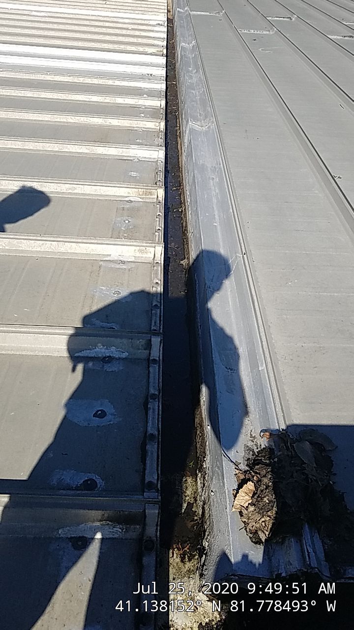 Commercial Metal Roof Coating by Gold Star Roofing LLC