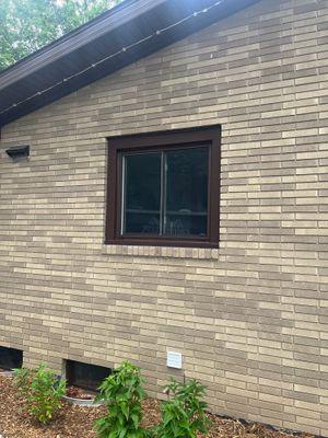 Dark Brown Window Installation for Midland Brick Ranch Home