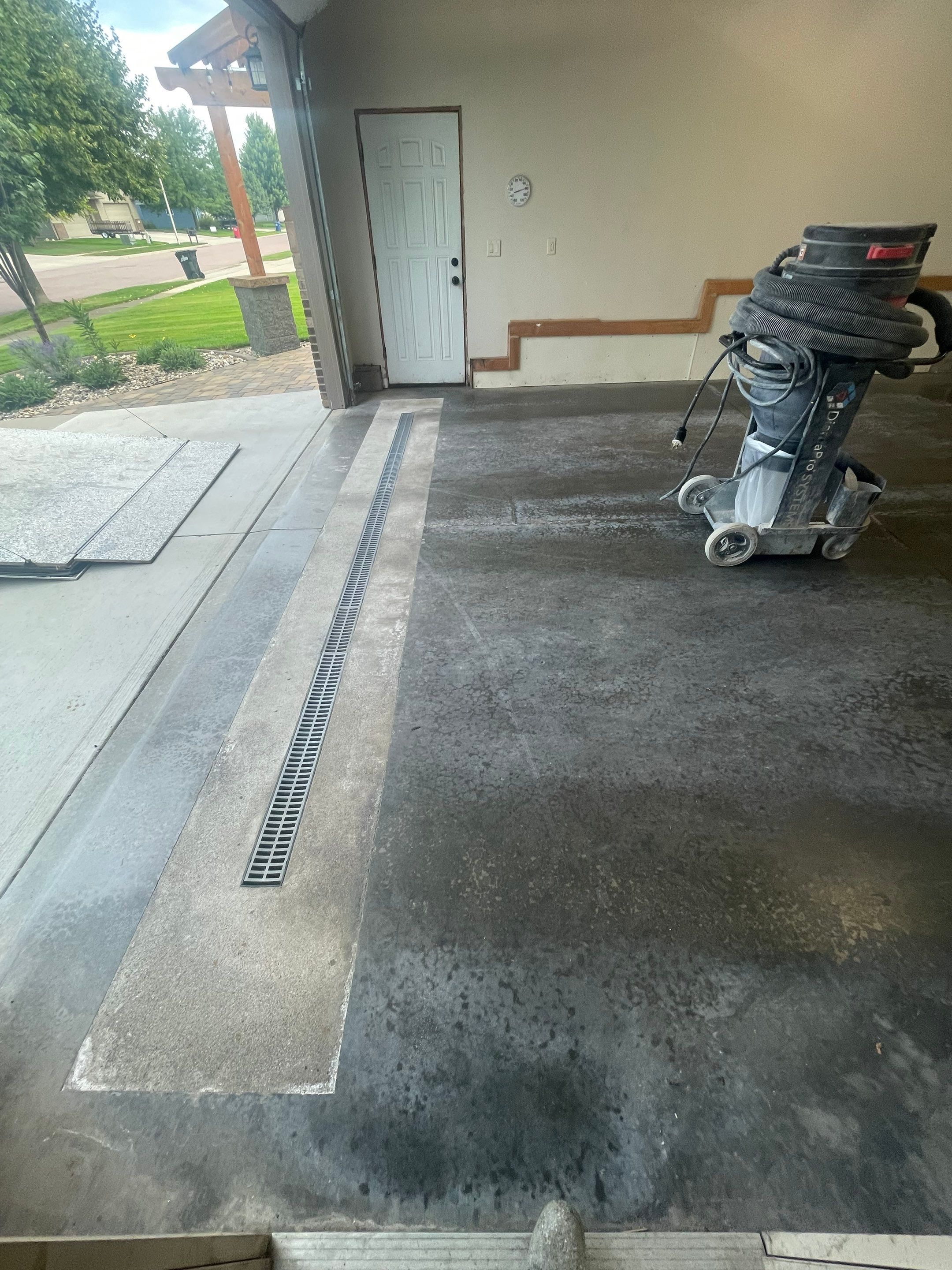 Multi-Stall Garage Floor Coating Installation in Sioux Falls by Select Painting, Coatings & Garage Cabinets