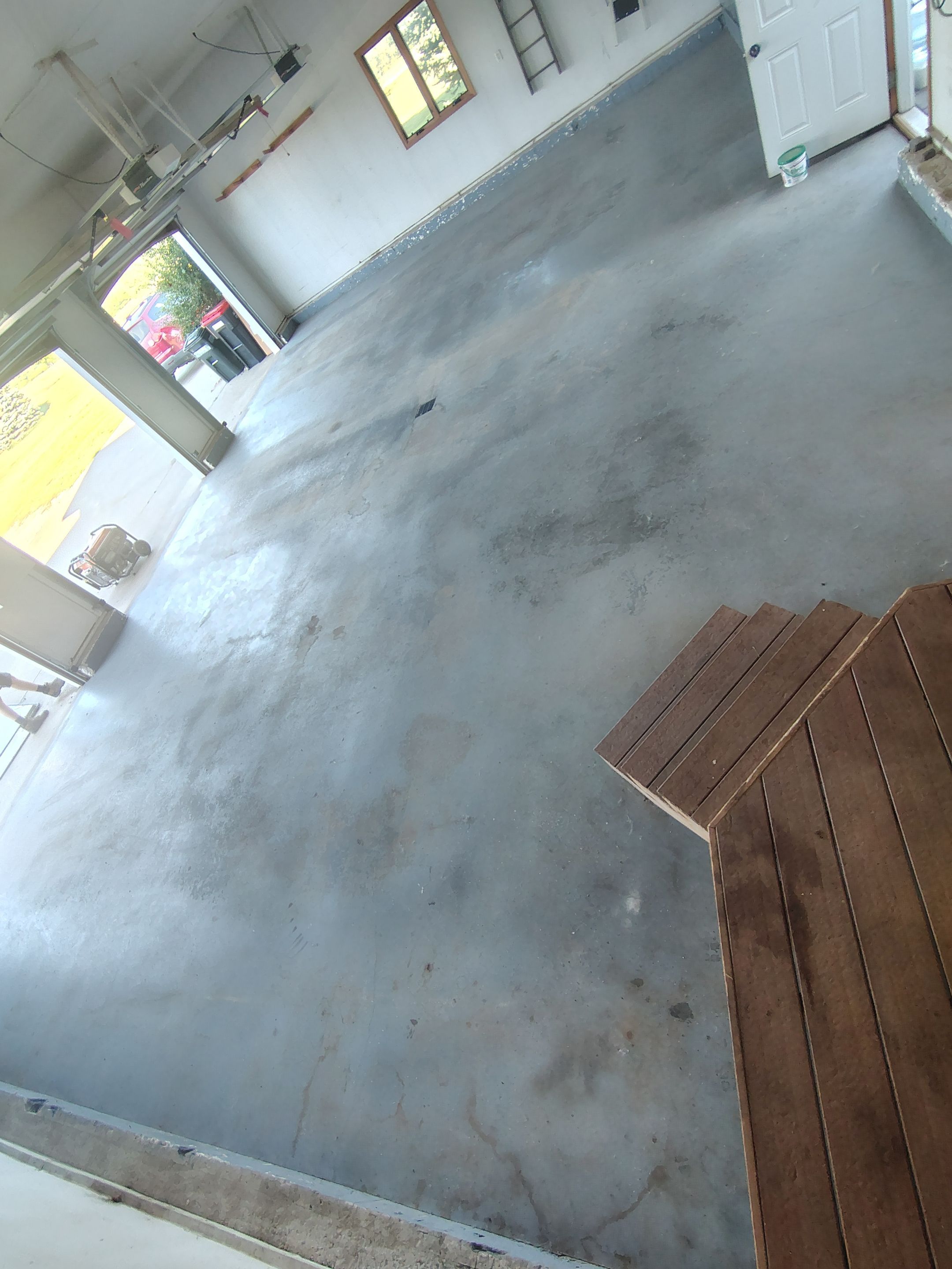 Feather Grey Garage Floor Coating Installation in Valley Springs by Select Painting, Coatings & Garage Cabinets