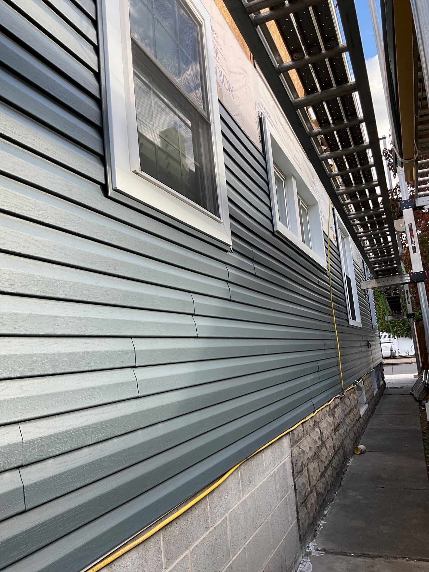 Charcoal Metal Roof & Blue Siding — A Refreshing New Look by Esh Builders