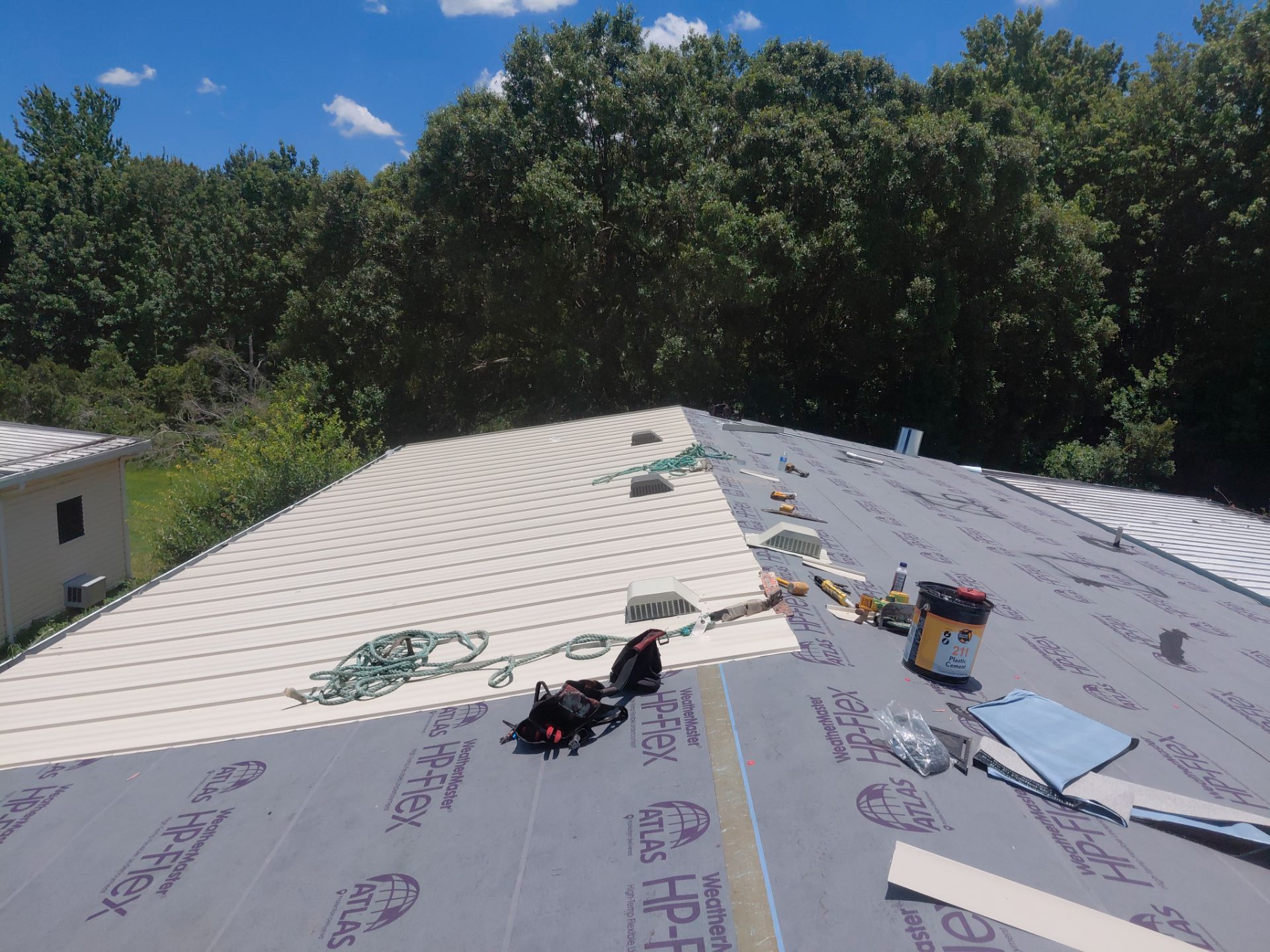 Orlando Residential Standing Seam Metal Roof Installation in Light Stone by Pinnacle Roofing Group