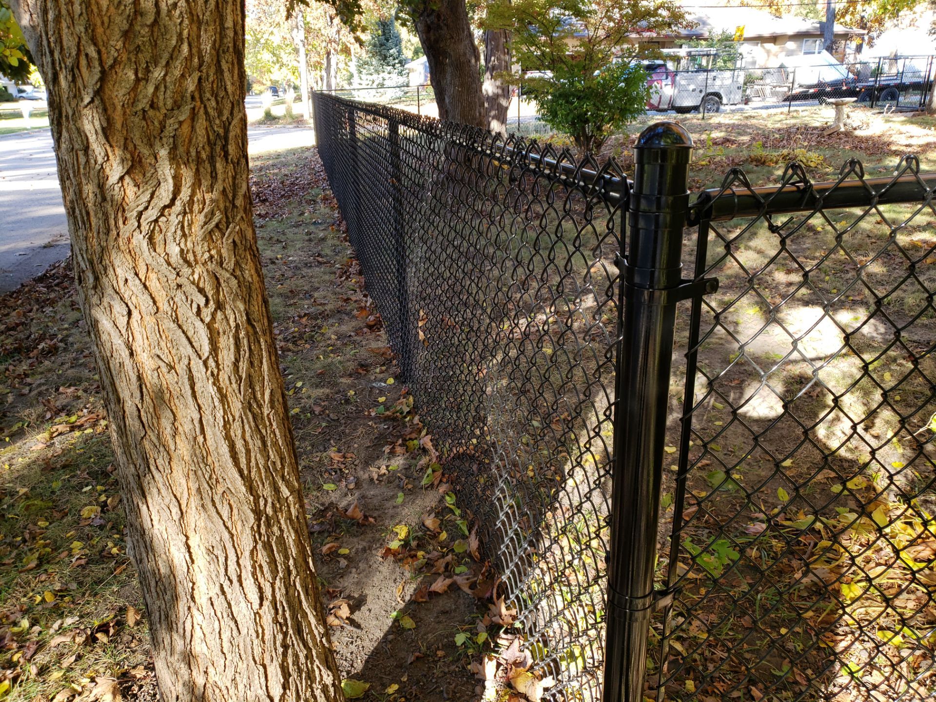 Black Chain Link Fence Installation in Cedar Falls, Iowa by Perfect Picket Fence and Stain