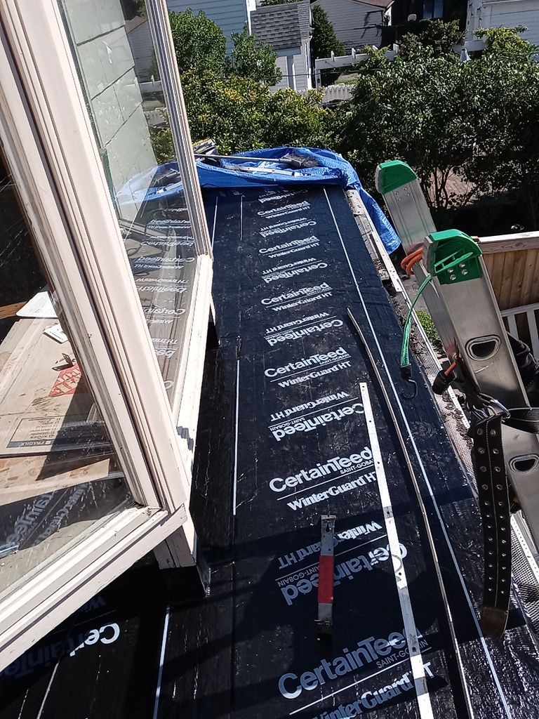 Residential Roofing Installation, Dec-tek walk-out porch roof, siding on garage by Absolute Roofing and Construction