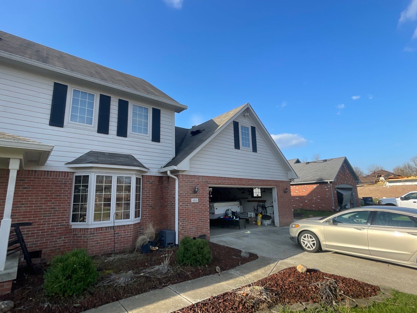Tornado damage in Whiteland. Roof replacement, James Hardie siding, exterior paint, gutters, windows, doors by 317 Roofing & Restorations