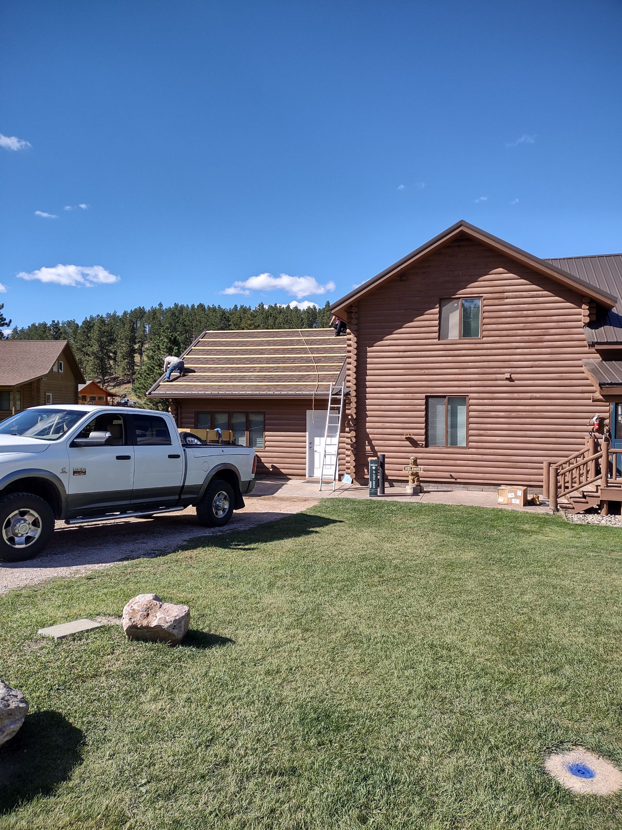 Hill Country Guest Ranch using Steel Roofing, Gutters, Log Cabin Staining by Lightning Exteriors