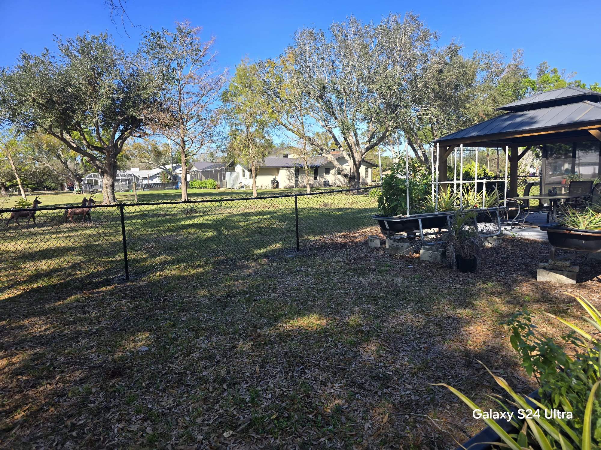 Black Chain Link Fence Installation in Port Charlotte by True Fence LLC