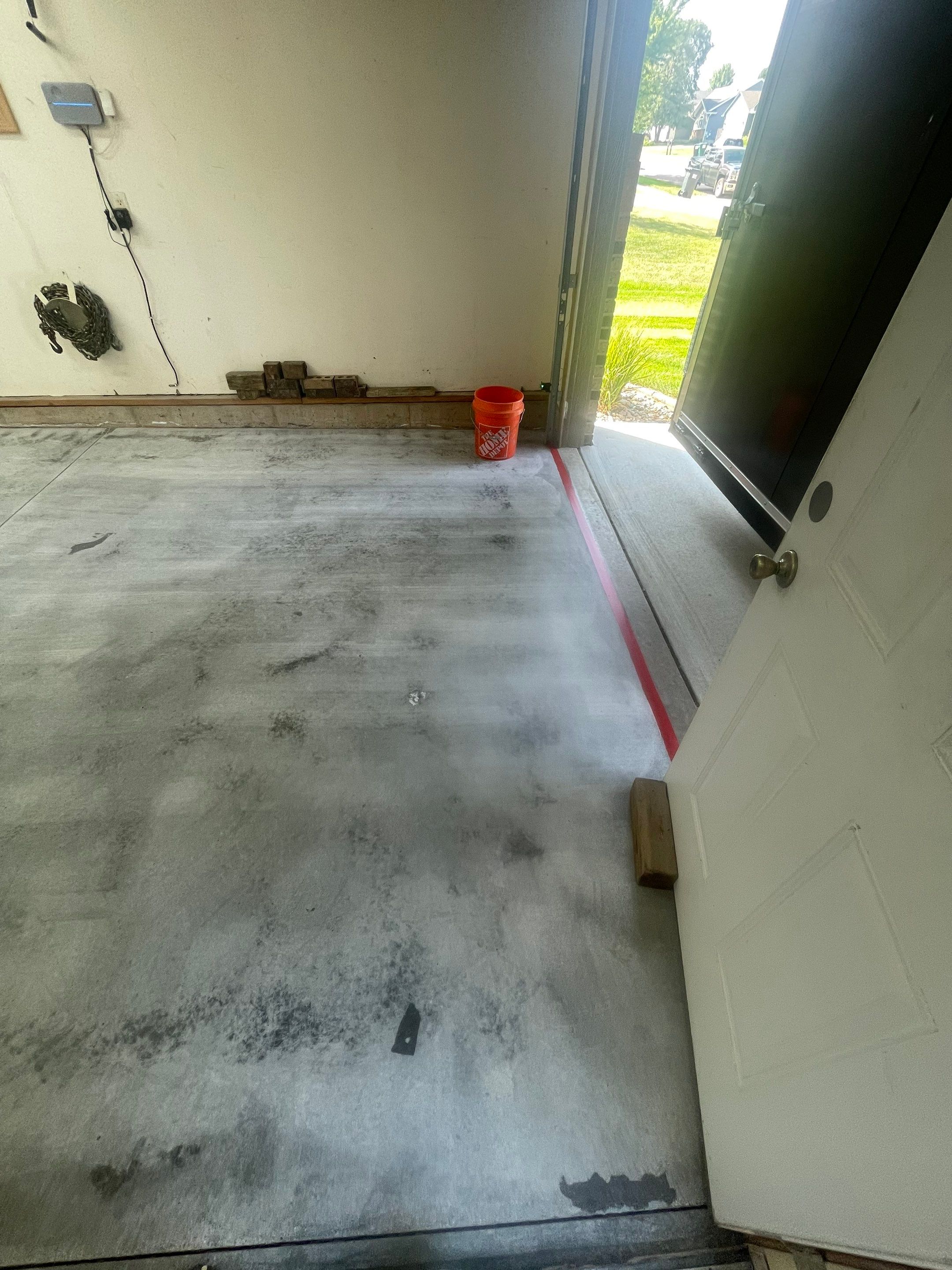 Multi-Stall Garage Floor Coating Installation in Sioux Falls by Select Painting, Coatings & Garage Cabinets