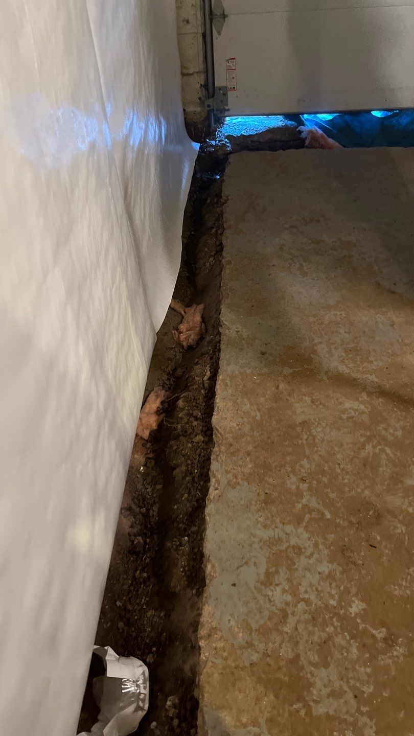 Basement Waterproofing using Drain tile system and a foundation wrap by ACE Waterproofing & Basement Solutions