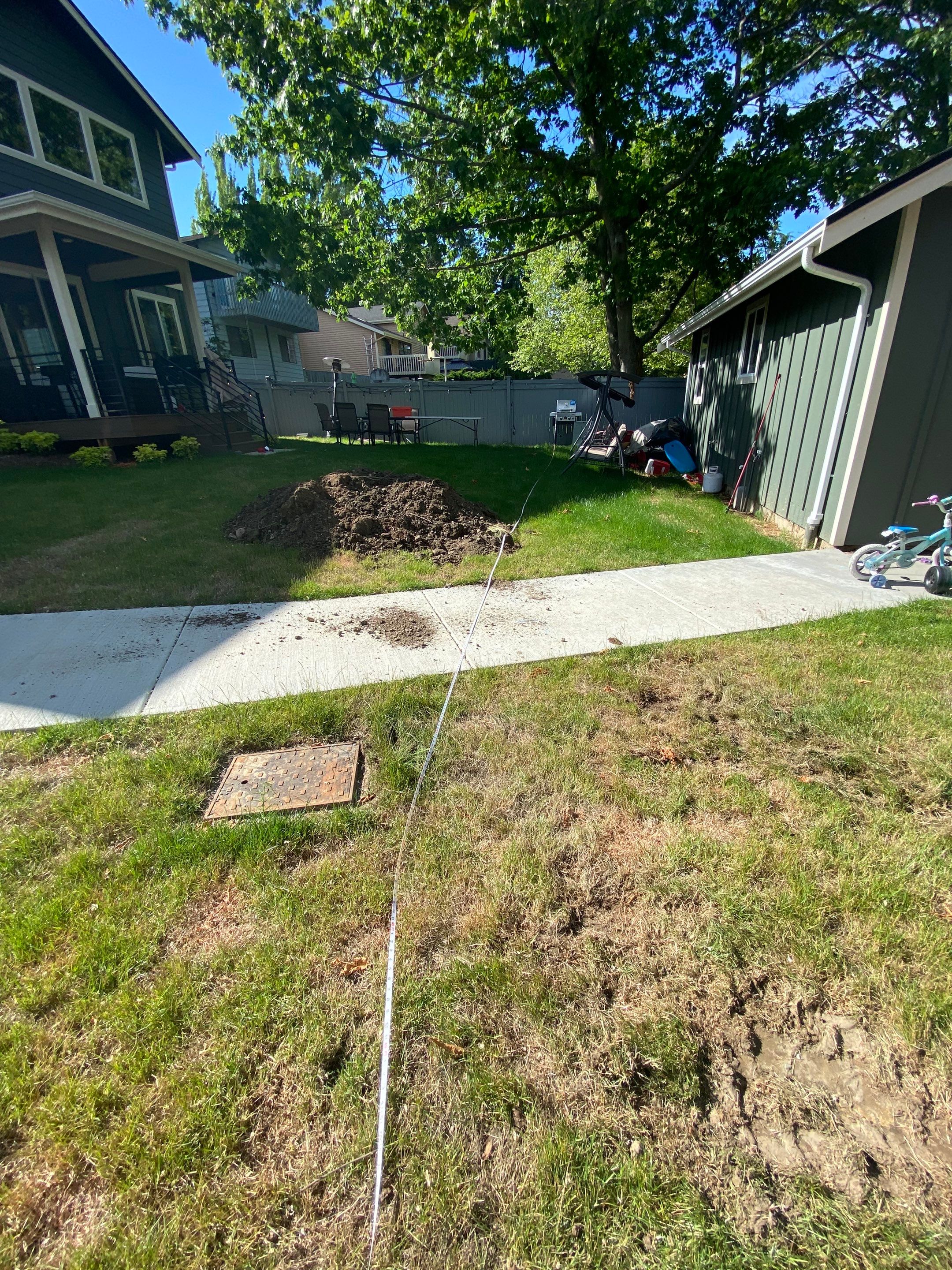 Patio Installation using Concrete, Retaining walls, and Turf install by Jireh Asphalt & Concrete Inc 