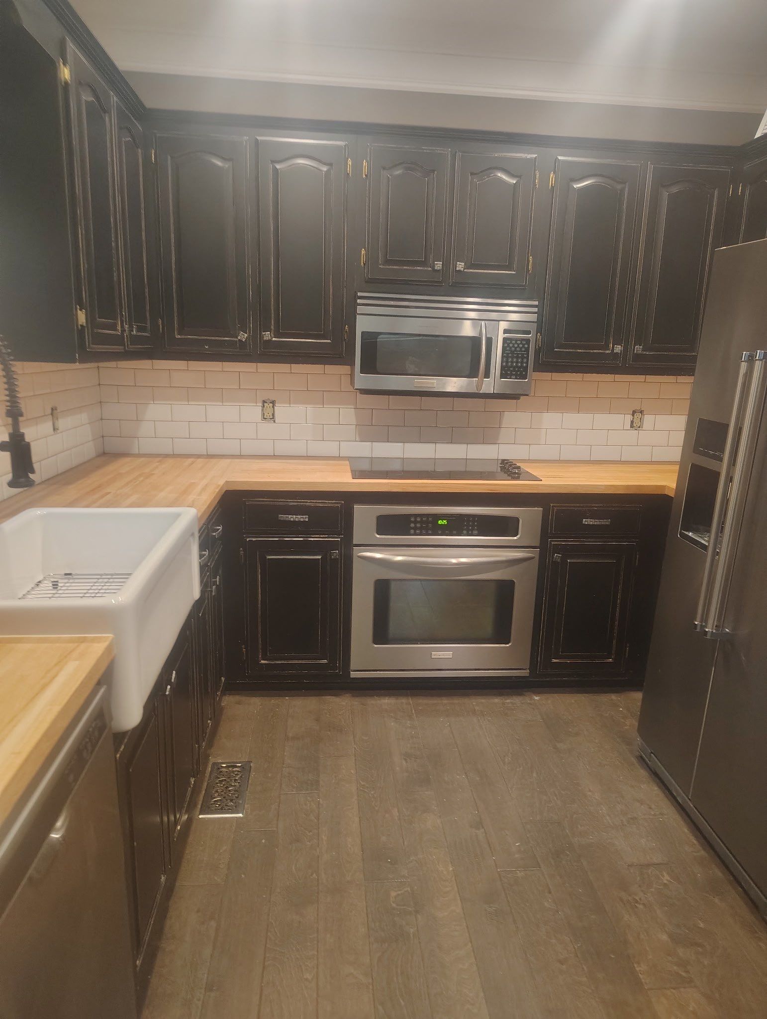 Subway tile backsplash  by Footprints Floors of Nashville