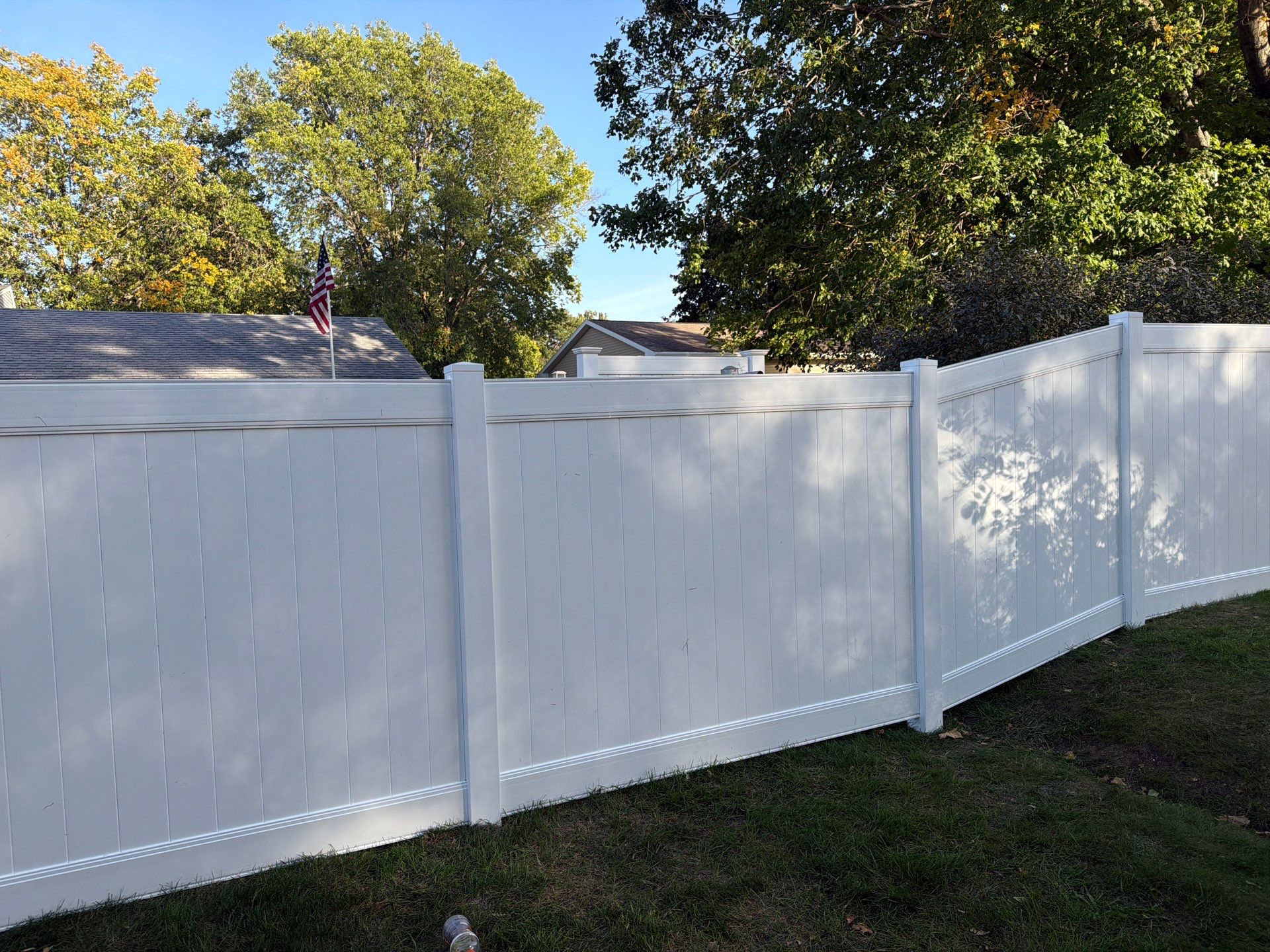 White Vinyl Privacy Fence and Gate Installation in Grundy Center by Perfect Picket Fence and Stain