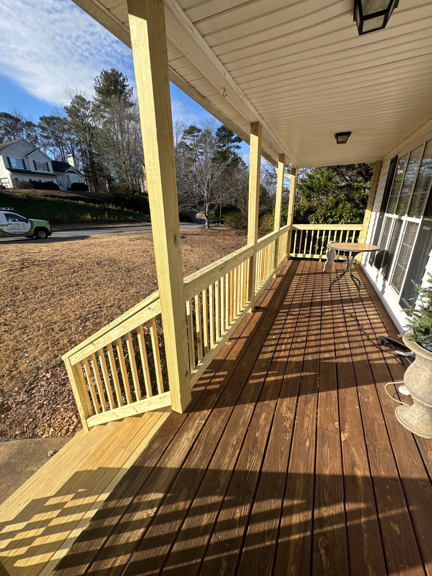 Pressure-Treated Porch Railing and Staircase Upgrade in Cumming by Swift Home Renovations