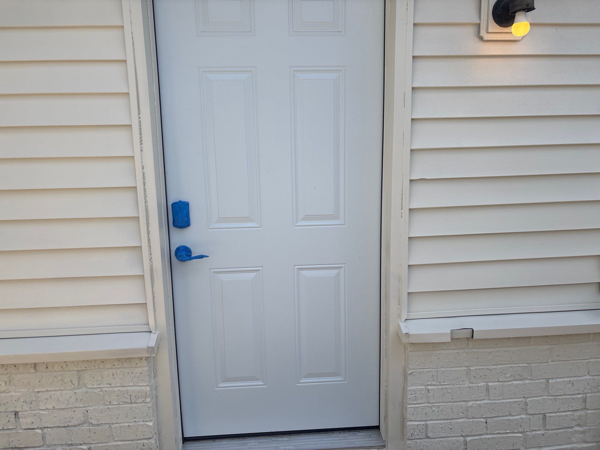 Exterior Painting in Flint, TX | White Brick Home & Metal Building with Sherwin-Williams Duration by Quality Coats Painting