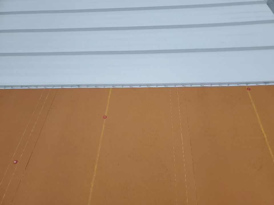 Residential Roofing Installation using 1.5" Nail Strip 24ga Solar White Kynar Coated Standing Seam Metal Panels by Morton Roofing, Inc.