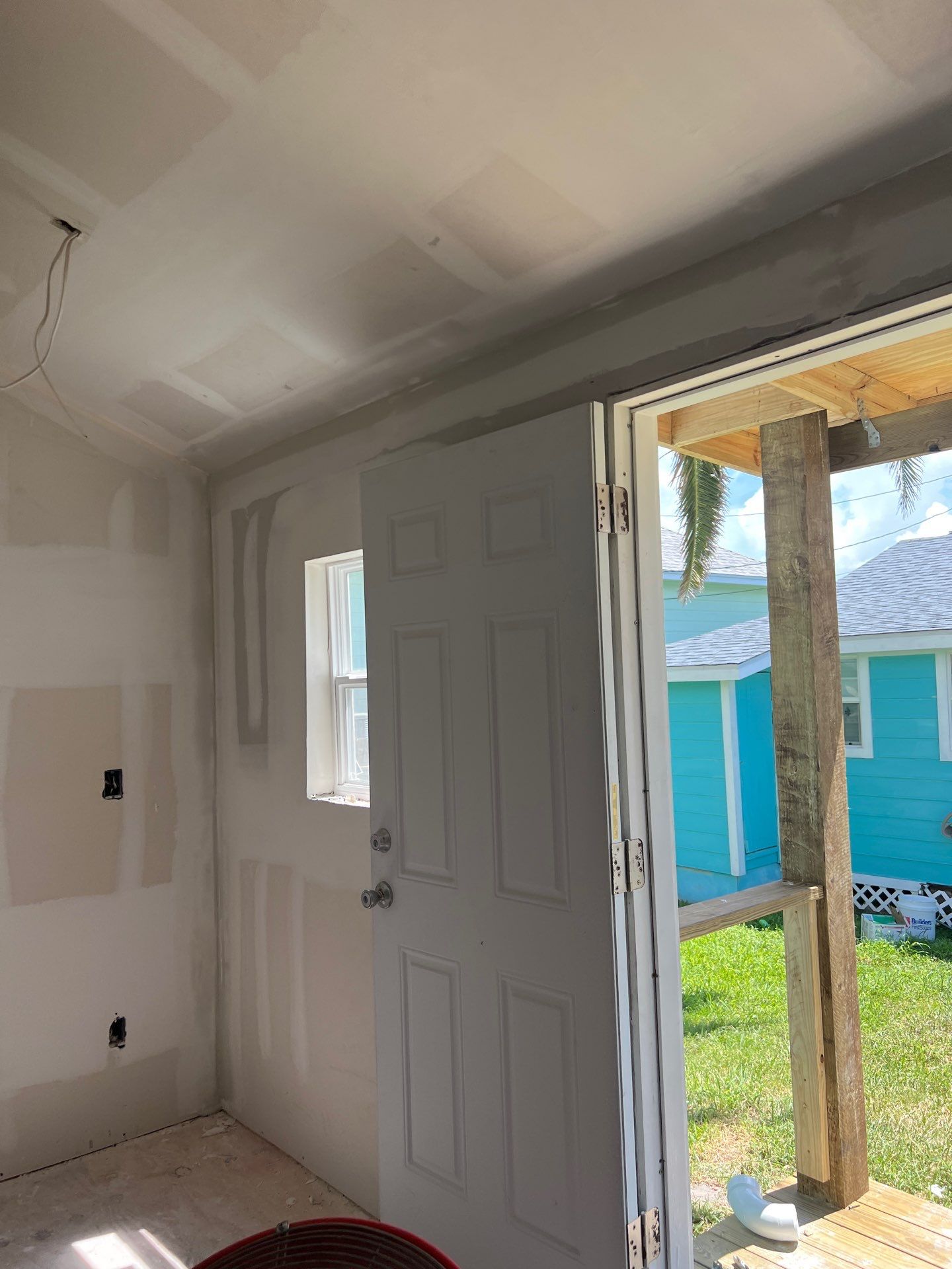 Stripped Beach Bungalow  by Bayfront Roofing and Construction