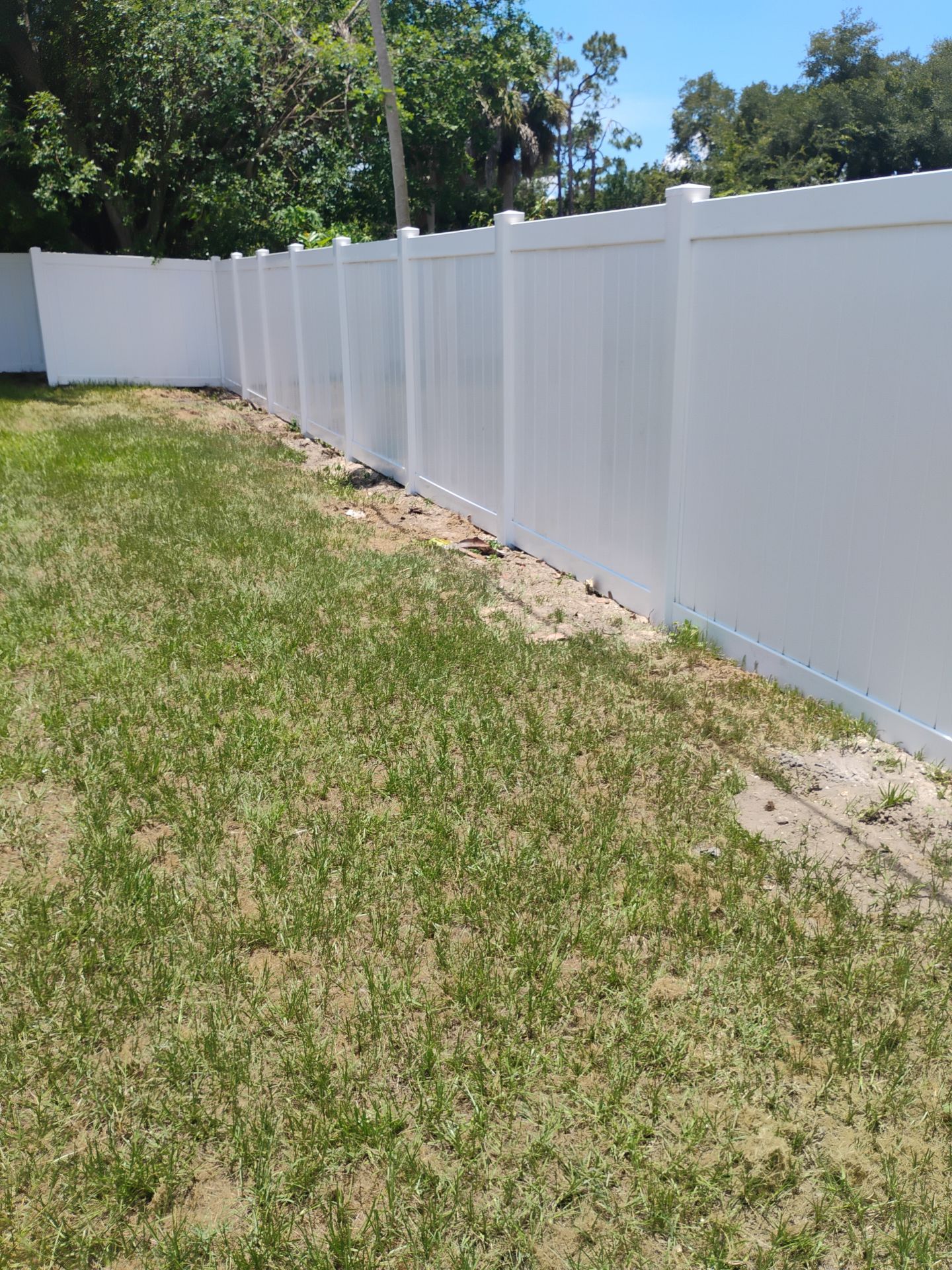 White Vinyl Privacy Fence Installation and Gate Repair in Port Charlotte by True Fence LLC