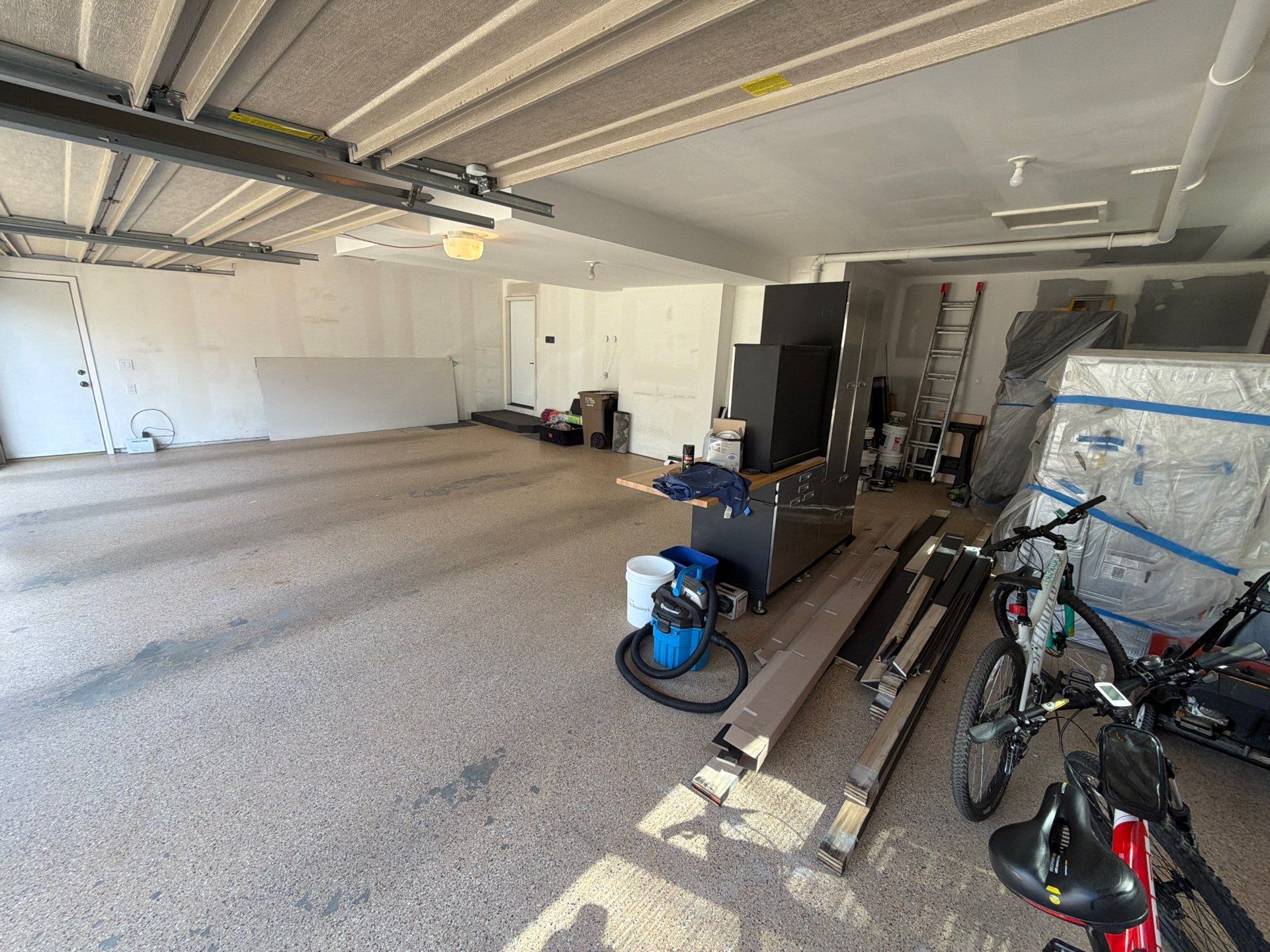 Gray Speckled Epoxy Garage Floor Coating in Sioux Falls by Select Painting, Coatings & Garage Cabinets