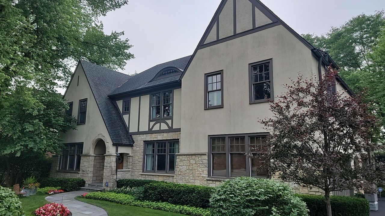 Northbrook, IL stucco home soft wash and stone cleaning by Northern Power Washing LLC.
