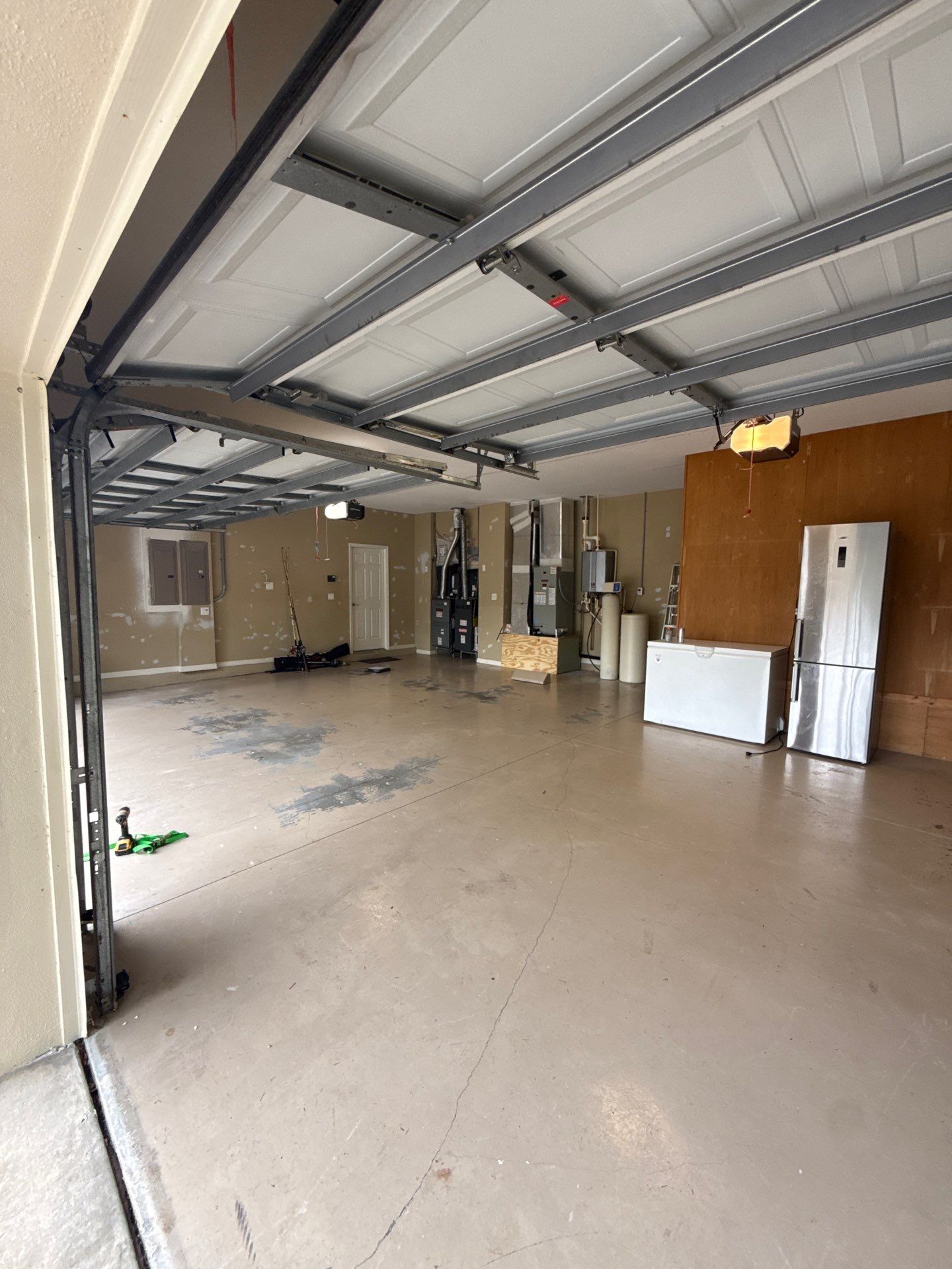 Tampa Garage Floor Coating and Overhead Storage Rack Installation by Square 1 Garage and Closet Solutions