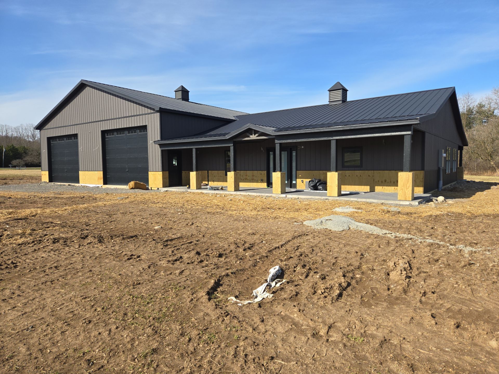 Barndominium  using Textured Board & Batton by Horst Custom Homes 