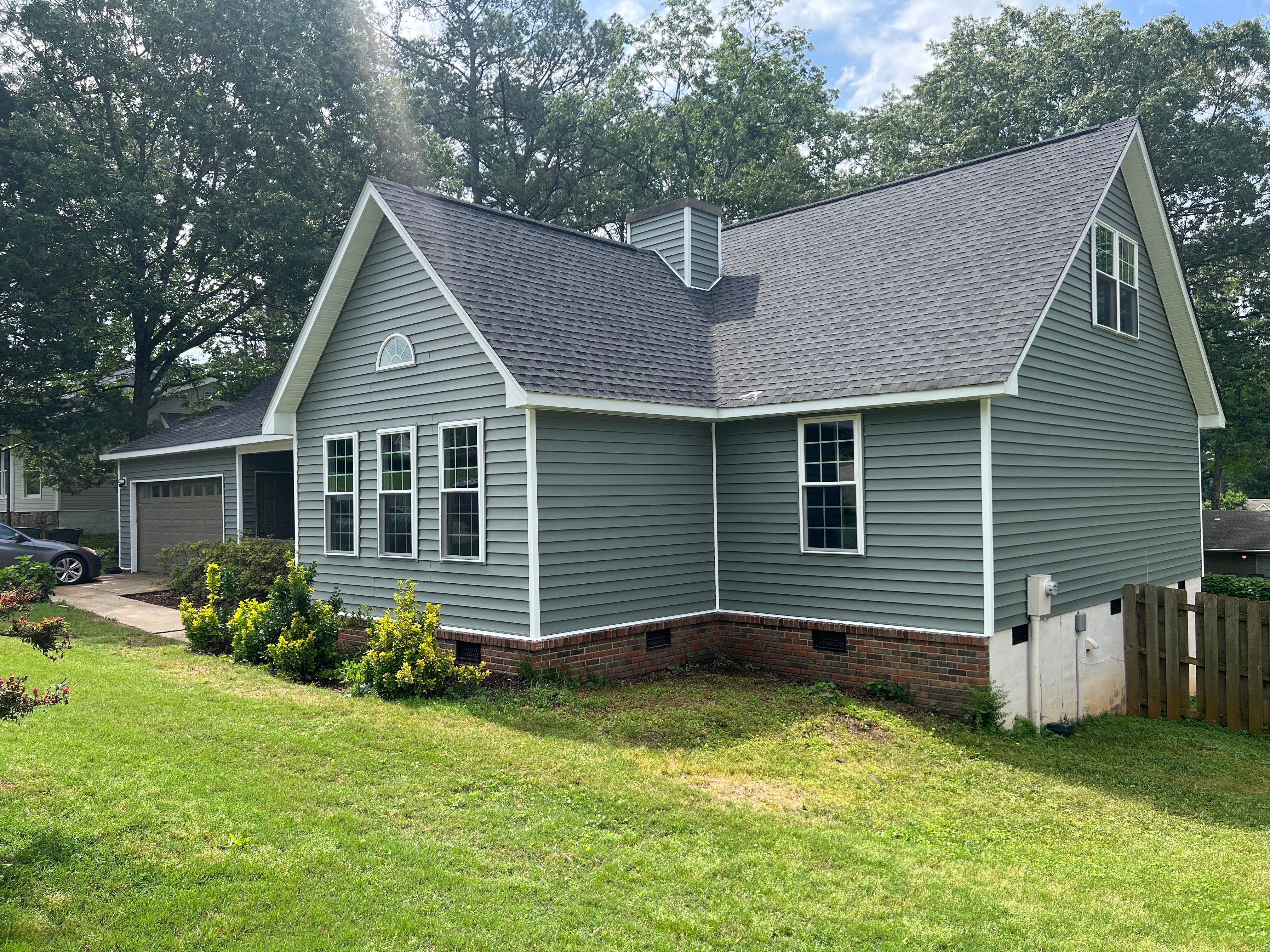 Siding Replacement using Mastic Carvedwood Vinyl Plank by Freedom Exteriors