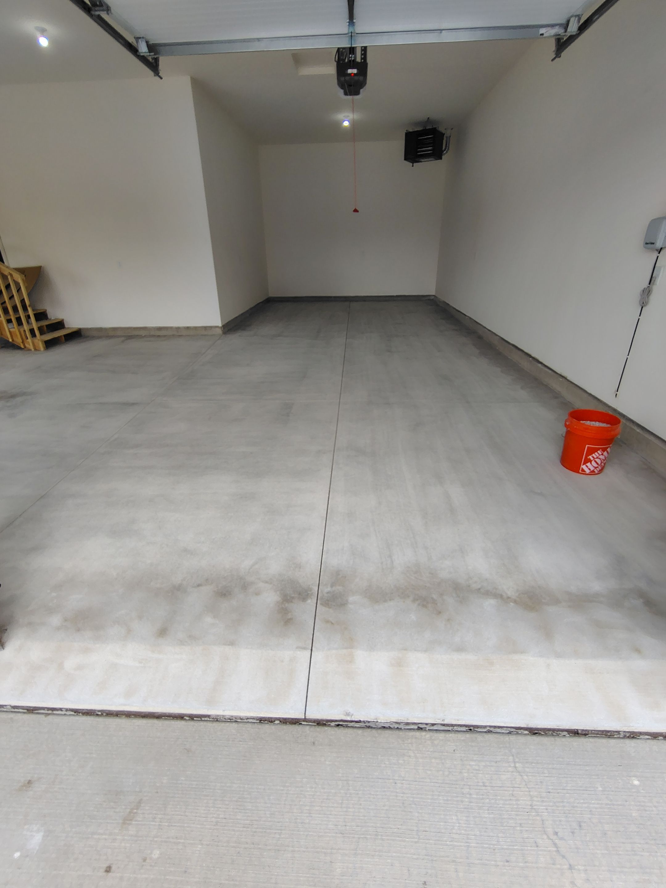Sioux Falls Garage Floor Transformation with Gray Decorative Flake Coating by Select Painting, Coatings & Garage Cabinets