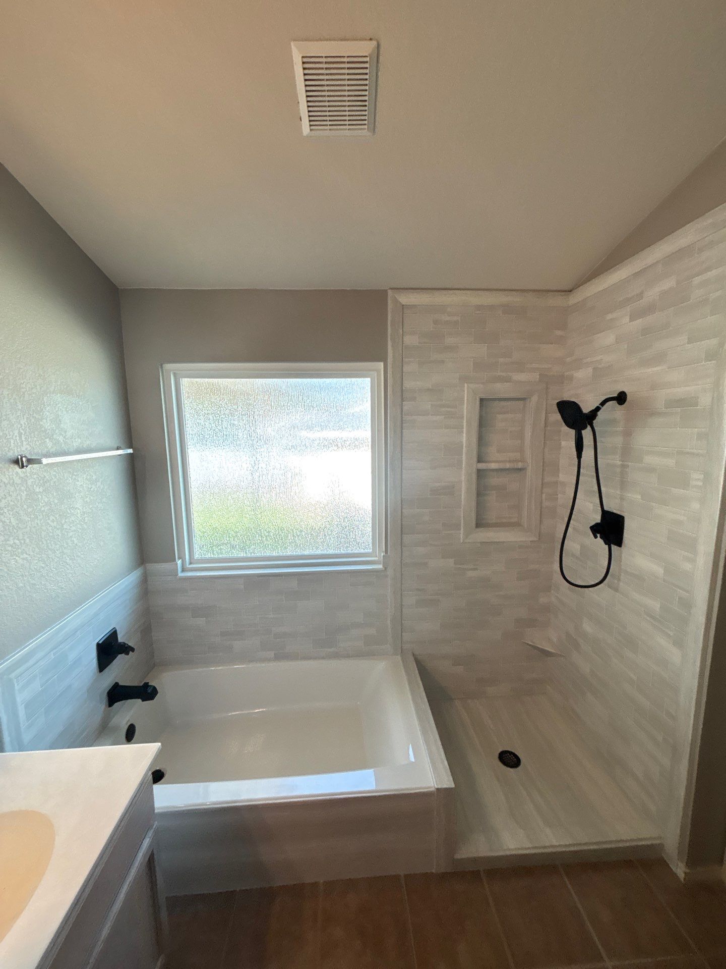 New walk in shower and tub in Kyle by Lane Lauritsen - The Hill Country, Texas