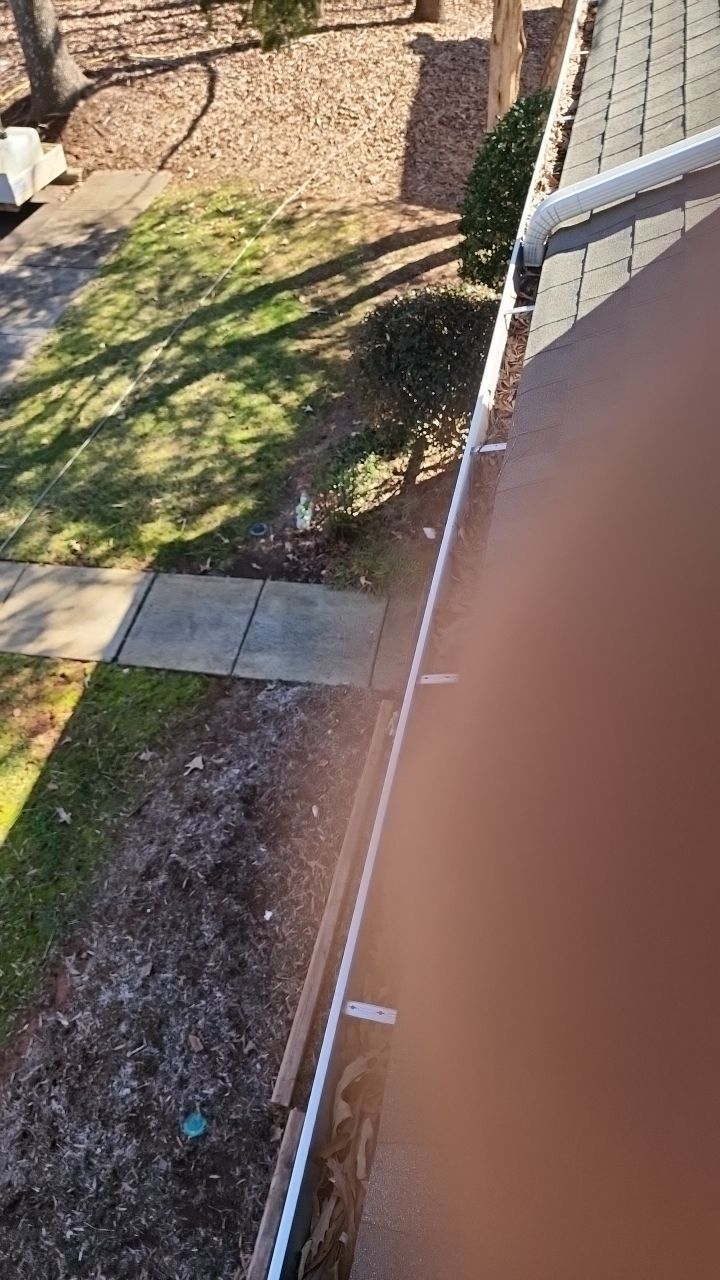 Gutter Cleaning using water by Power Wash Masters LLC