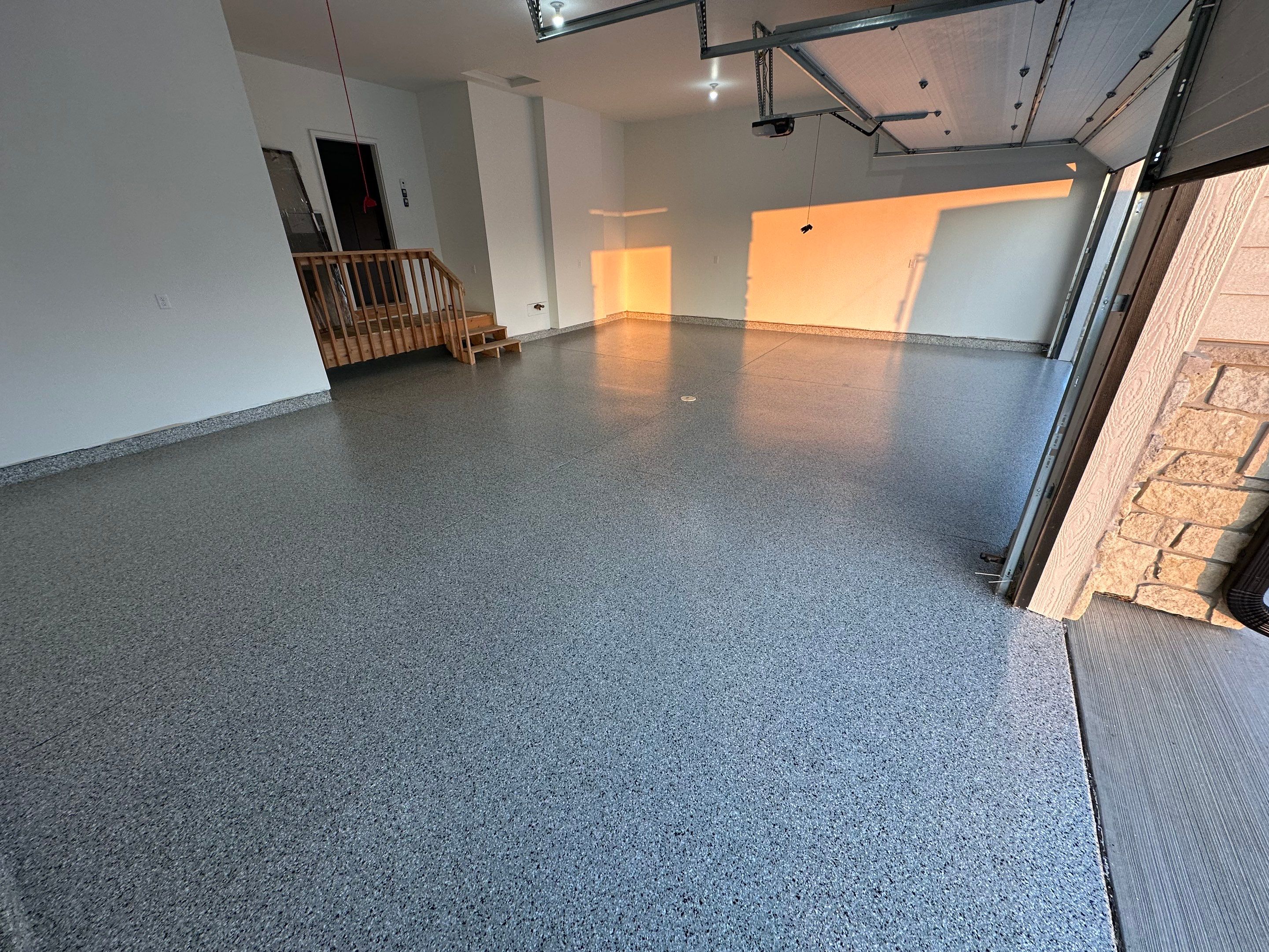 Cabin Fever Decorative Flake Garage Floor Coating in Sioux Falls by Select Painting, Coatings & Garage Cabinets