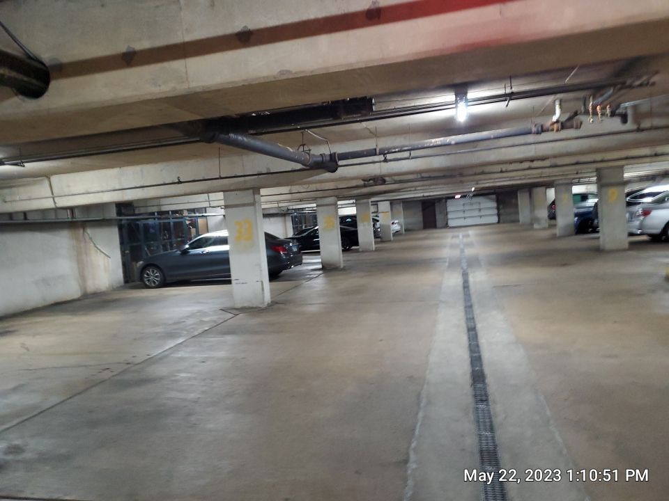 Parking garage using Hot water by Northern Power Washing LLC.